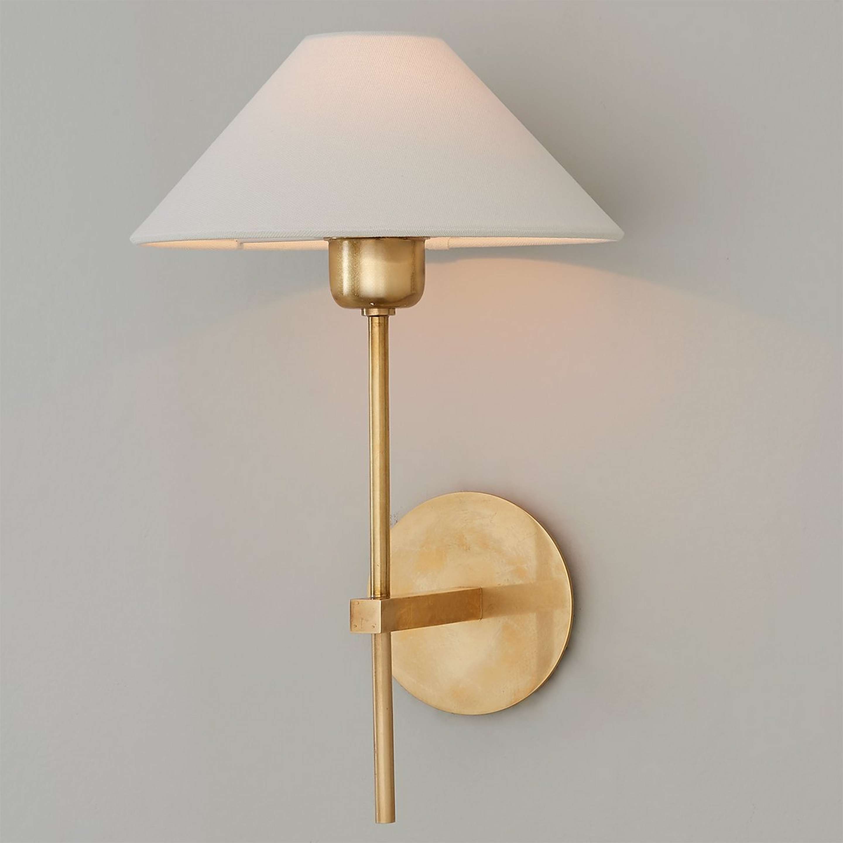 A Modern Shaded Rod Sconce with Hand-Rubbed Antique Brass color
