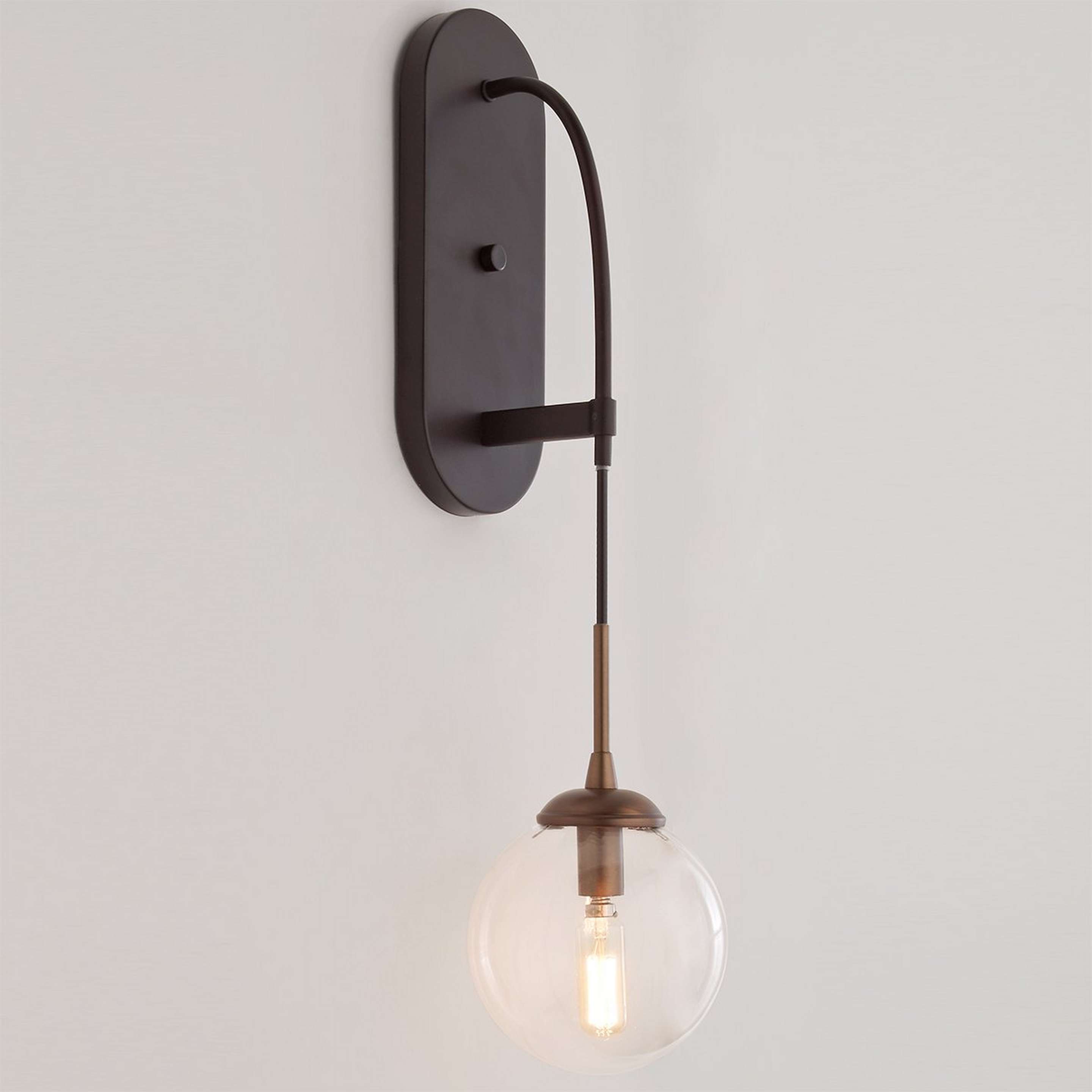 A Hanging Globe Sconce with Bronze / Brass color