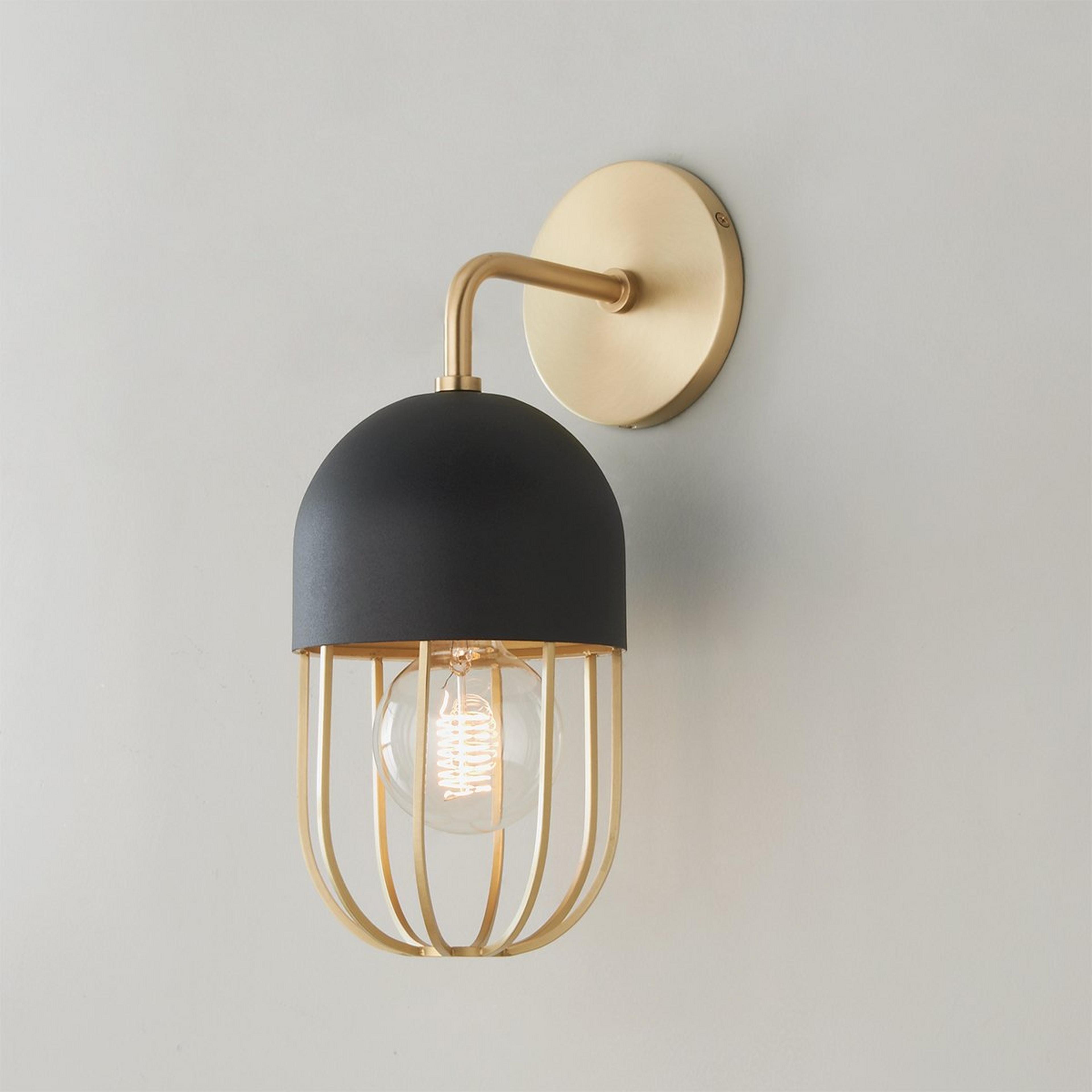 A Capsule Cage Sconce with Brushed Brass / Matte Black color