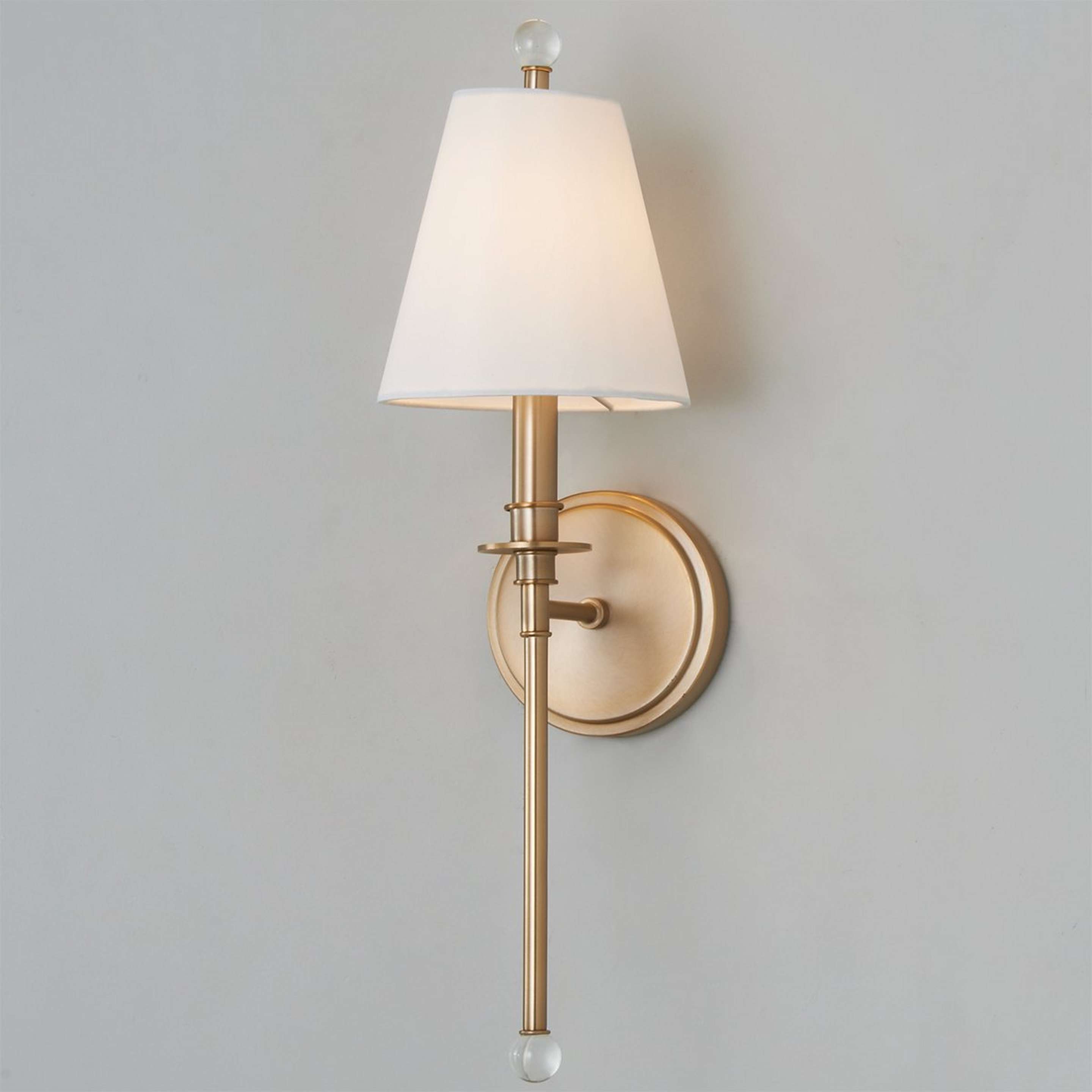 A Sleek Adorned Bar Sconce with Aged Brass color