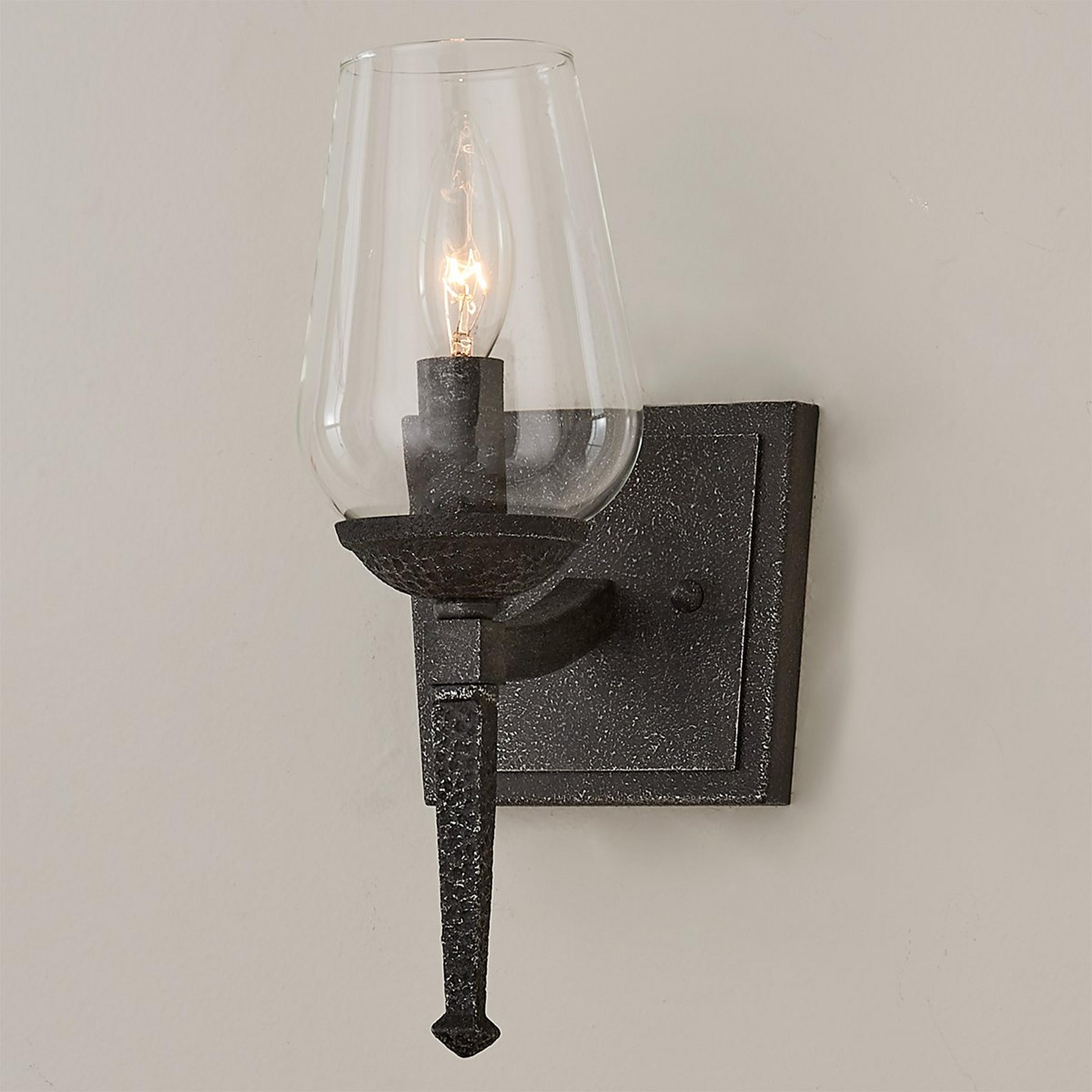 A Hammered Iron Torch Sconce with Black Natural Iron color