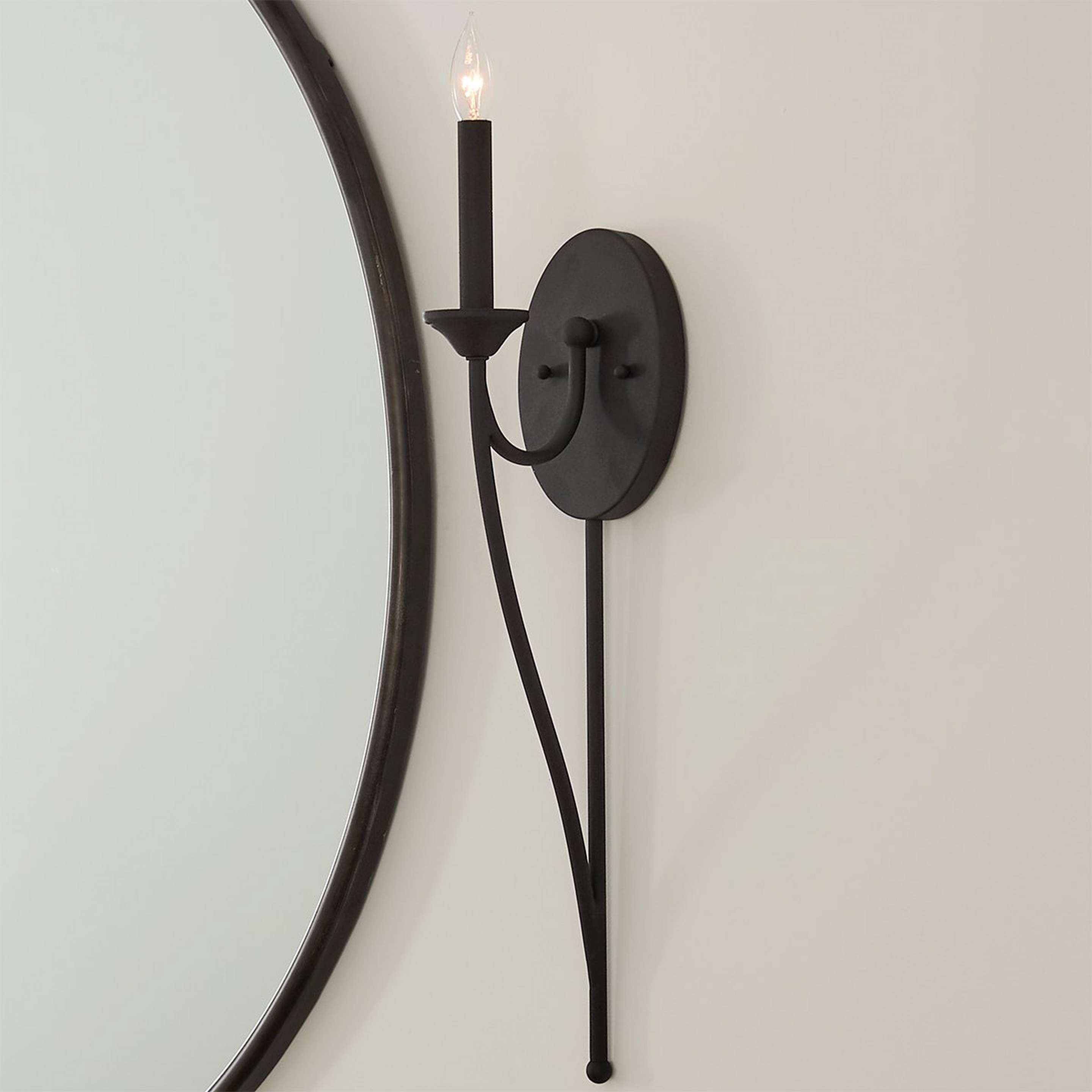 A Transitional Colonial Wall Sconce with Black color