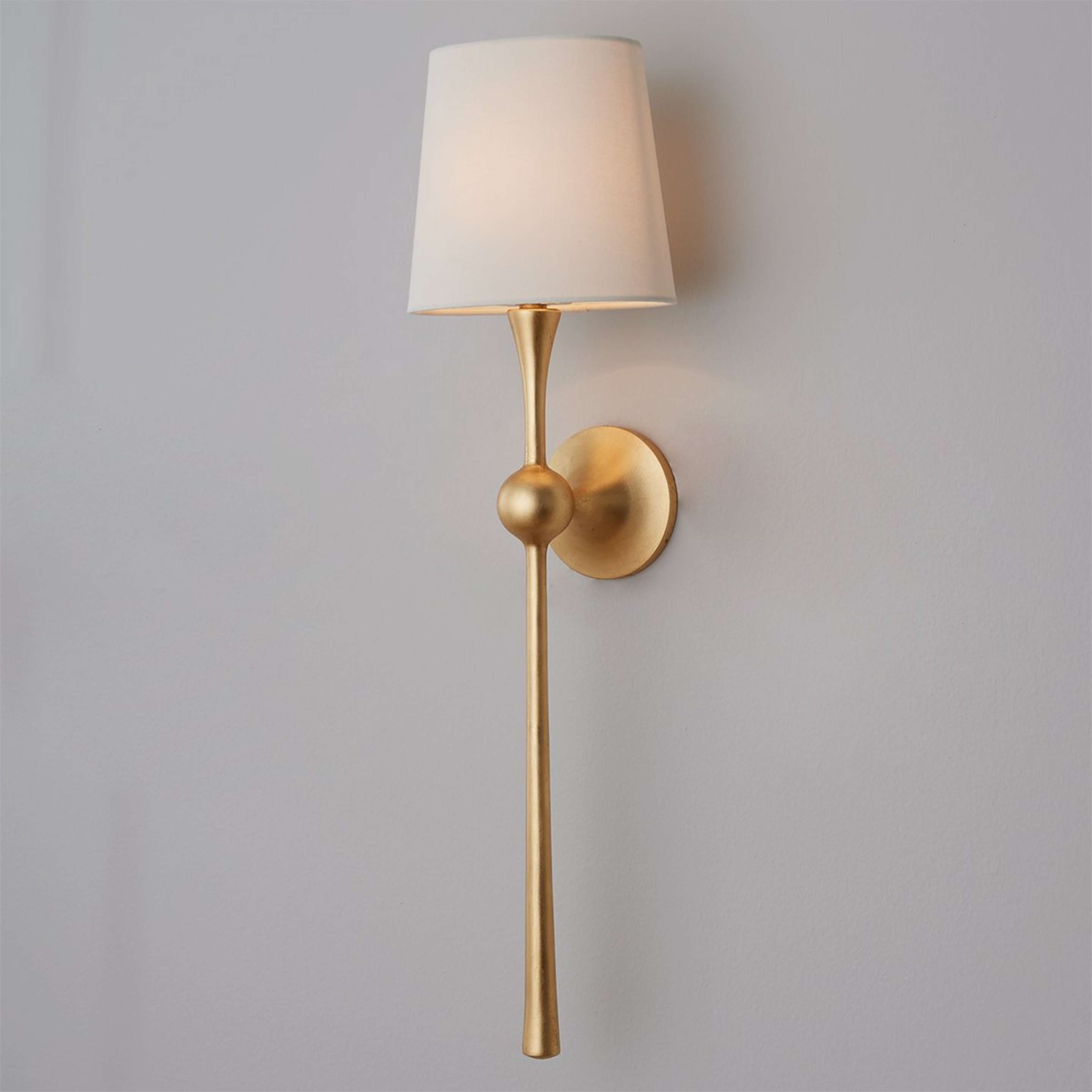 A Dagny Shaded Sconce with Aged Gold color