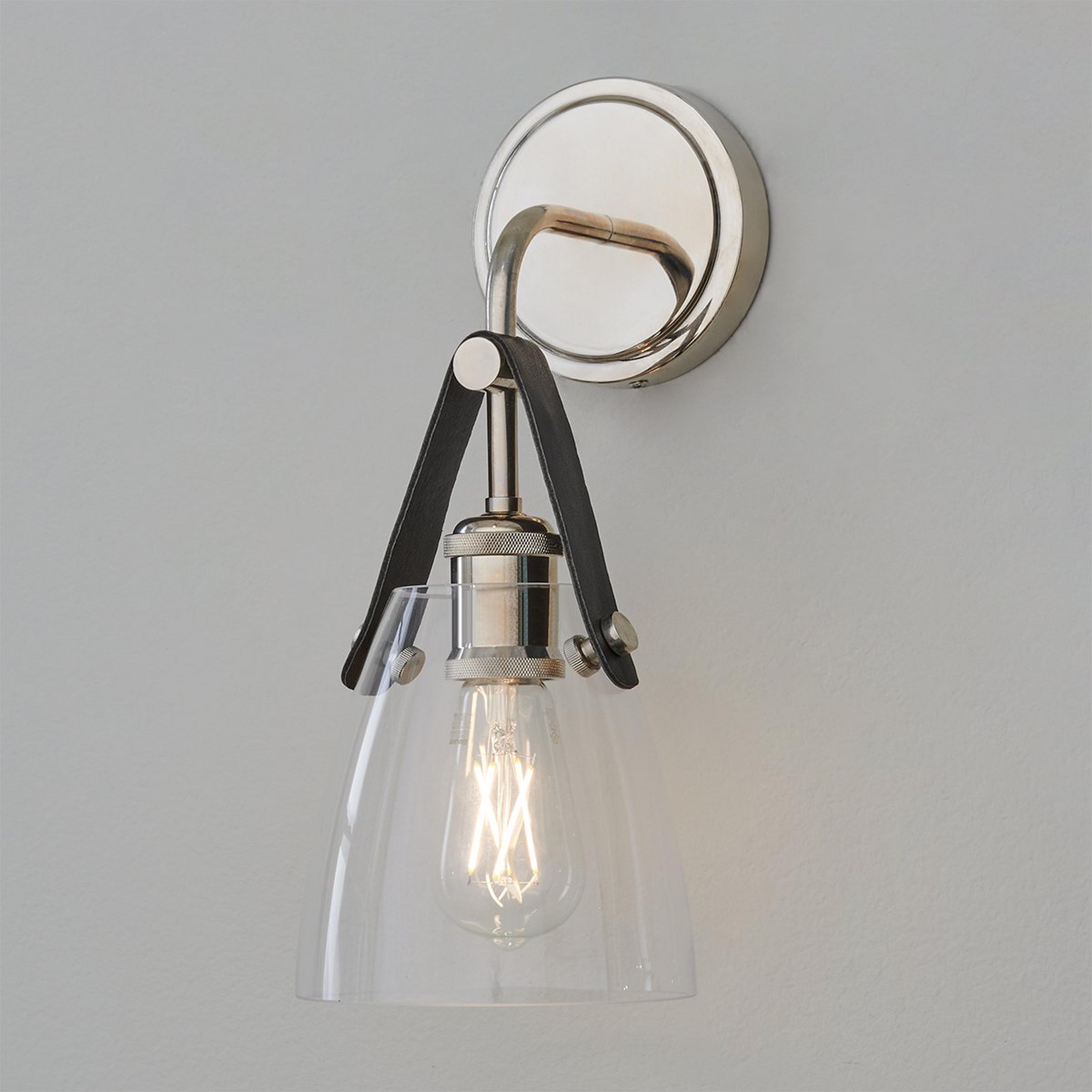 A Glass and Leather Sconce with Polished Nickel / Black Leather color