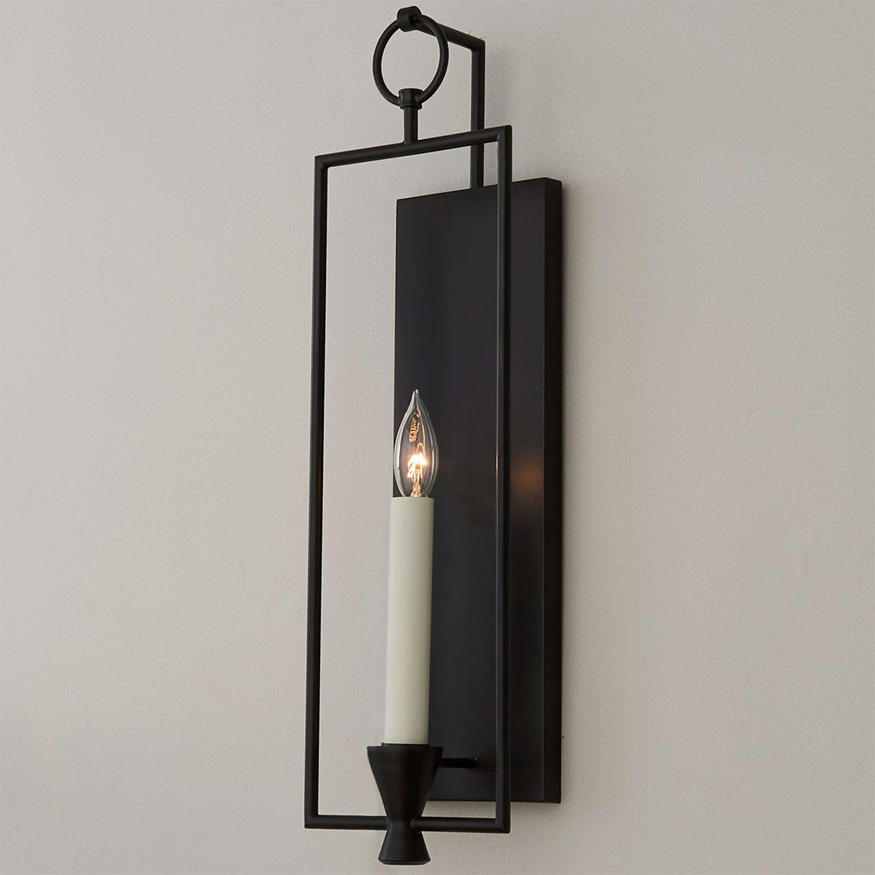 A Vintage Candle Sconce with Aged Iron color