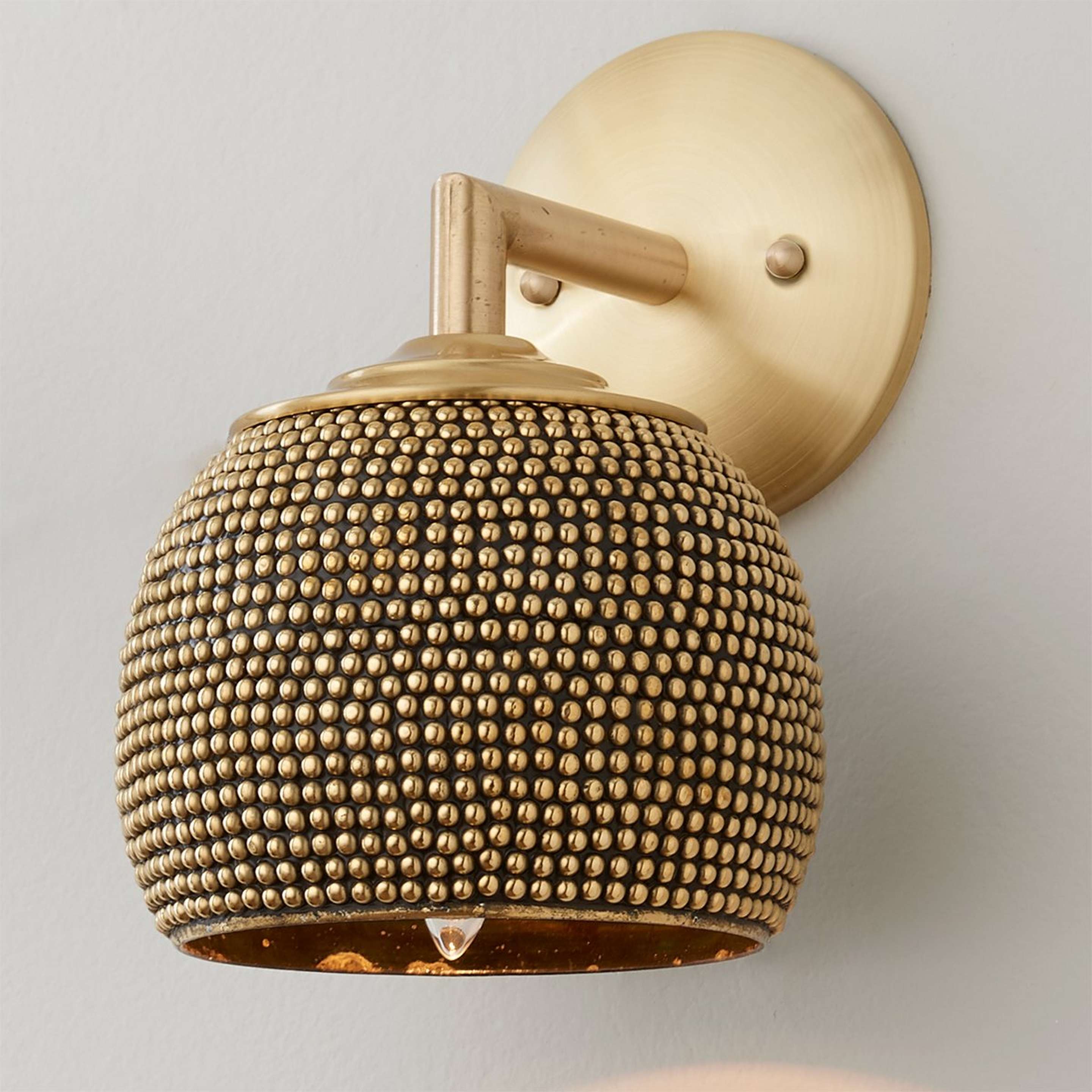 A Studded Brass Sconce with Antique Brass color