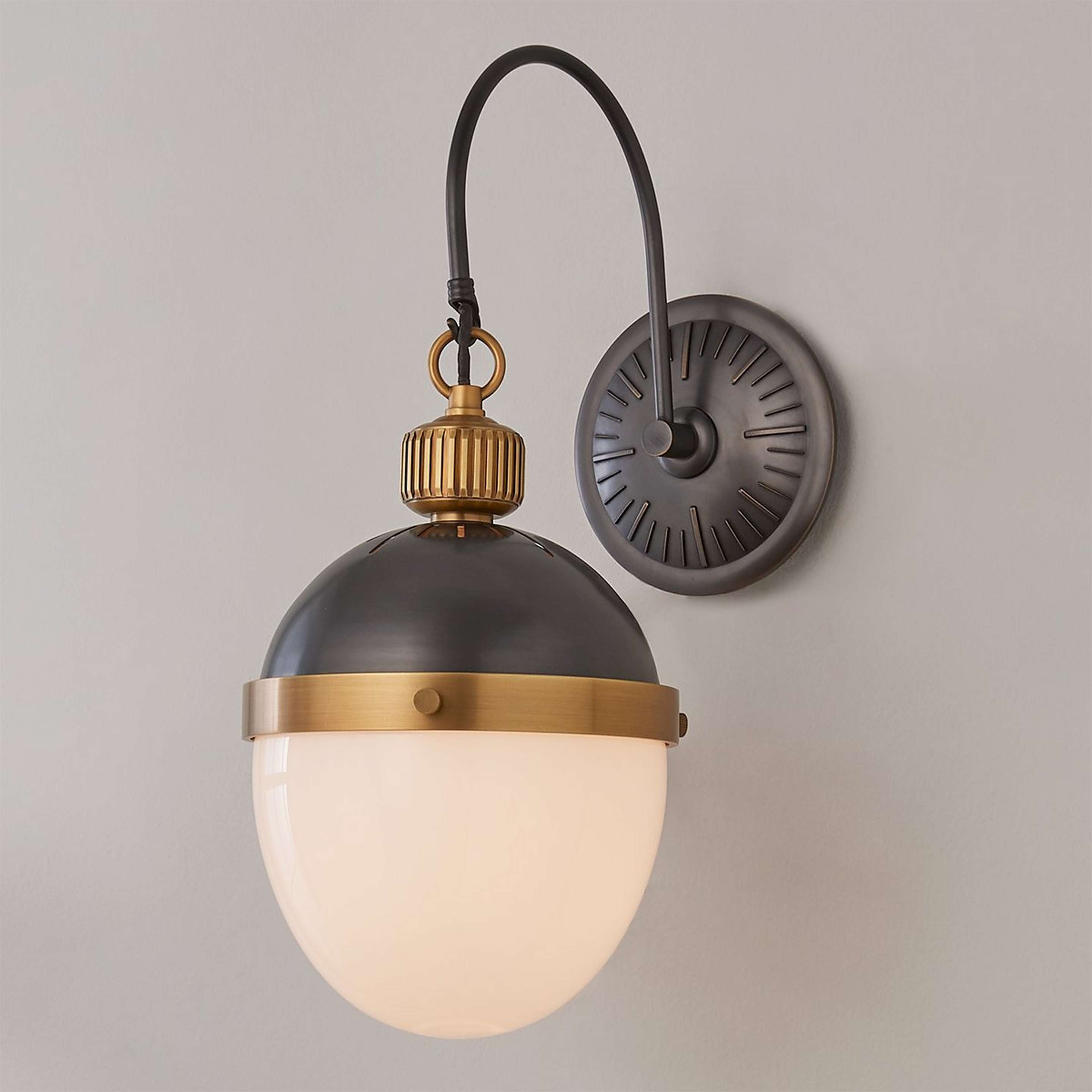 A Milla Sconce with Black / Brass color