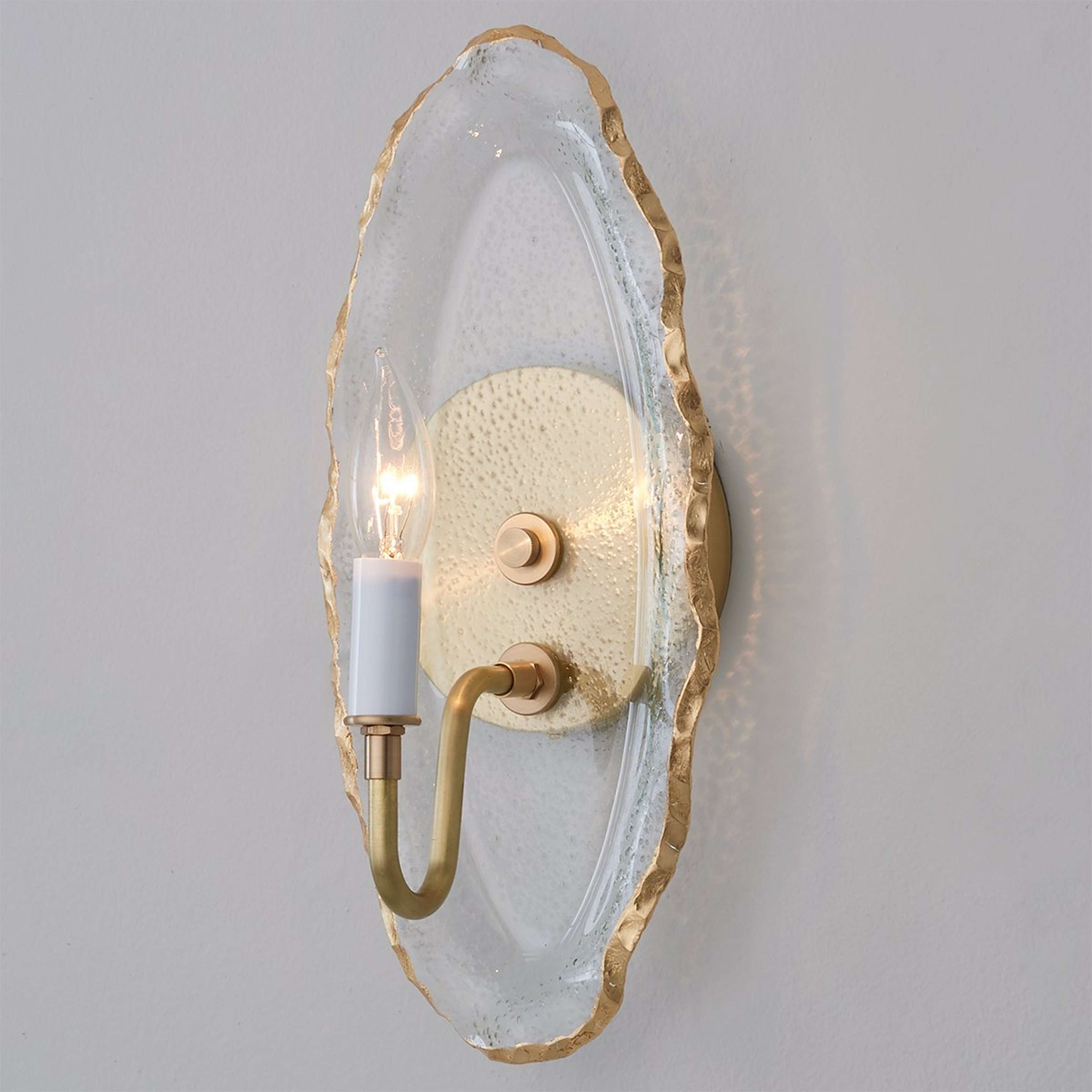 A Rock Candy Sconce with Brass / Clear Seeded Glass / Gold color