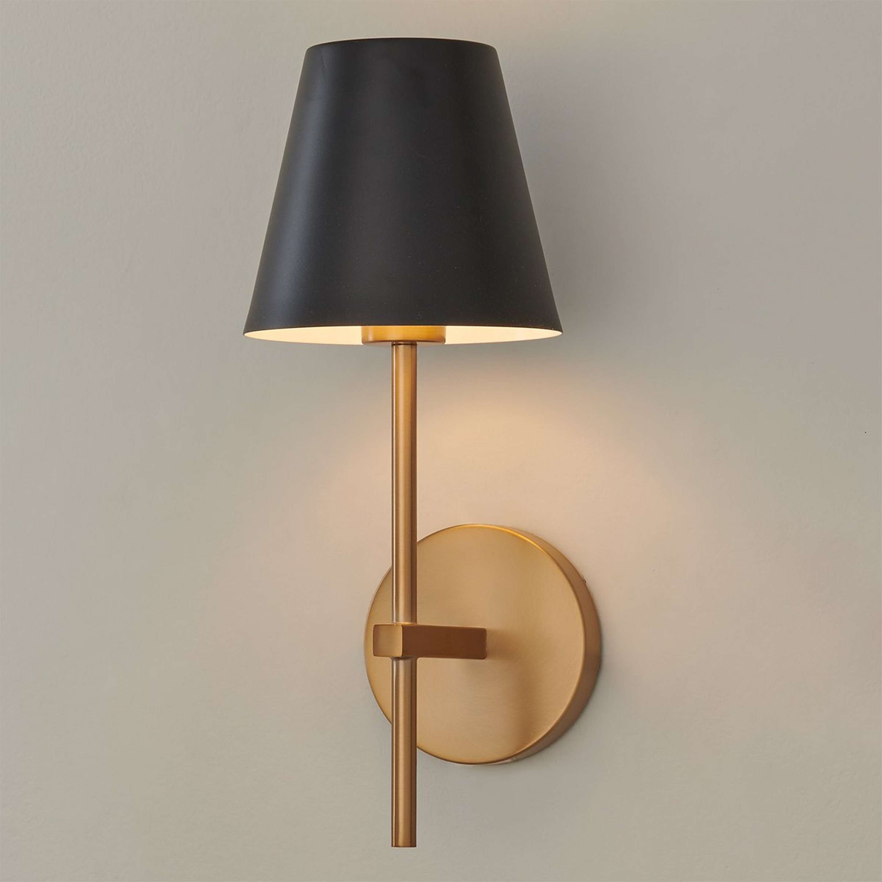 A Leoda Sconce with Gold / Matte Black color