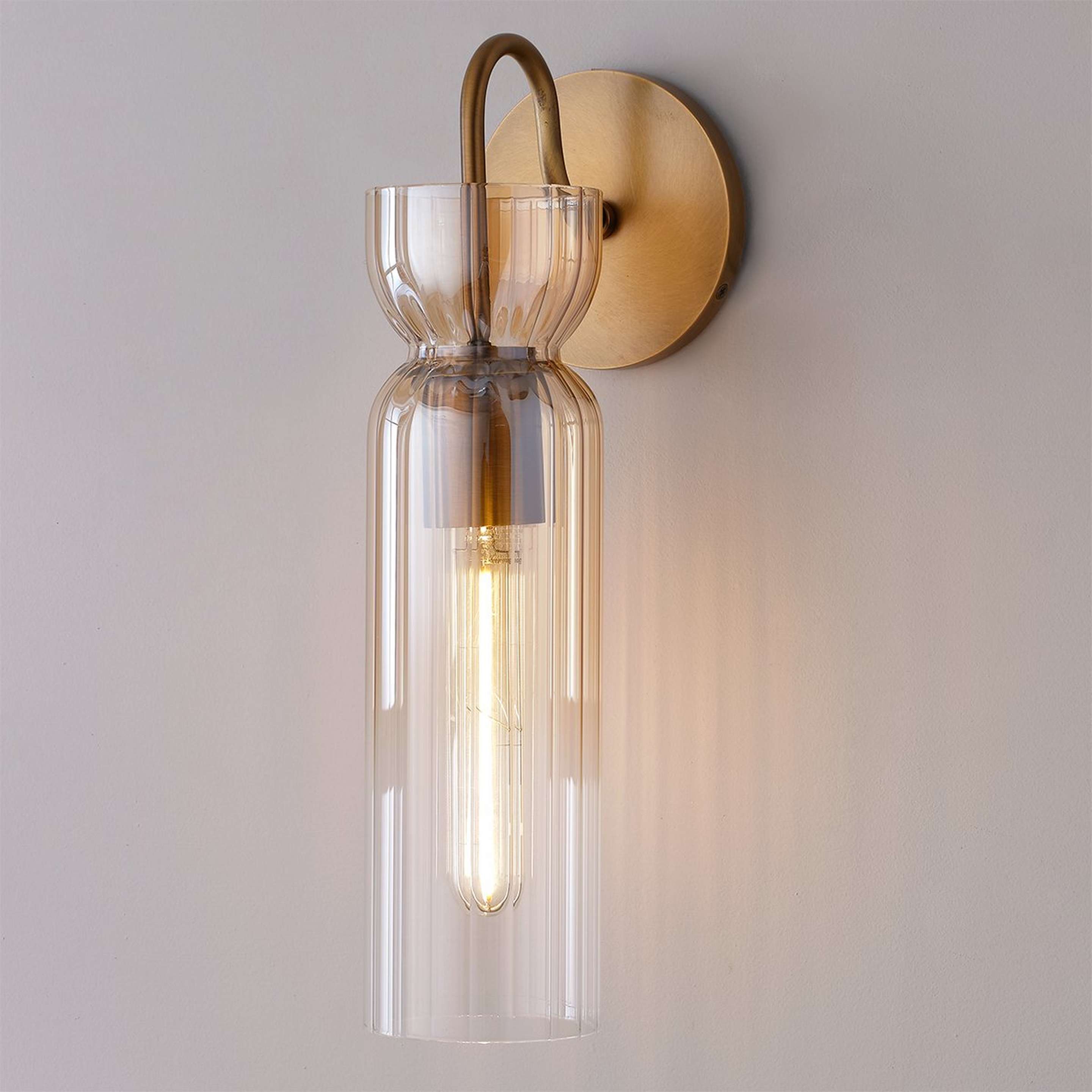 A Aminah Sconce with Aged Brass / Amber Glass color