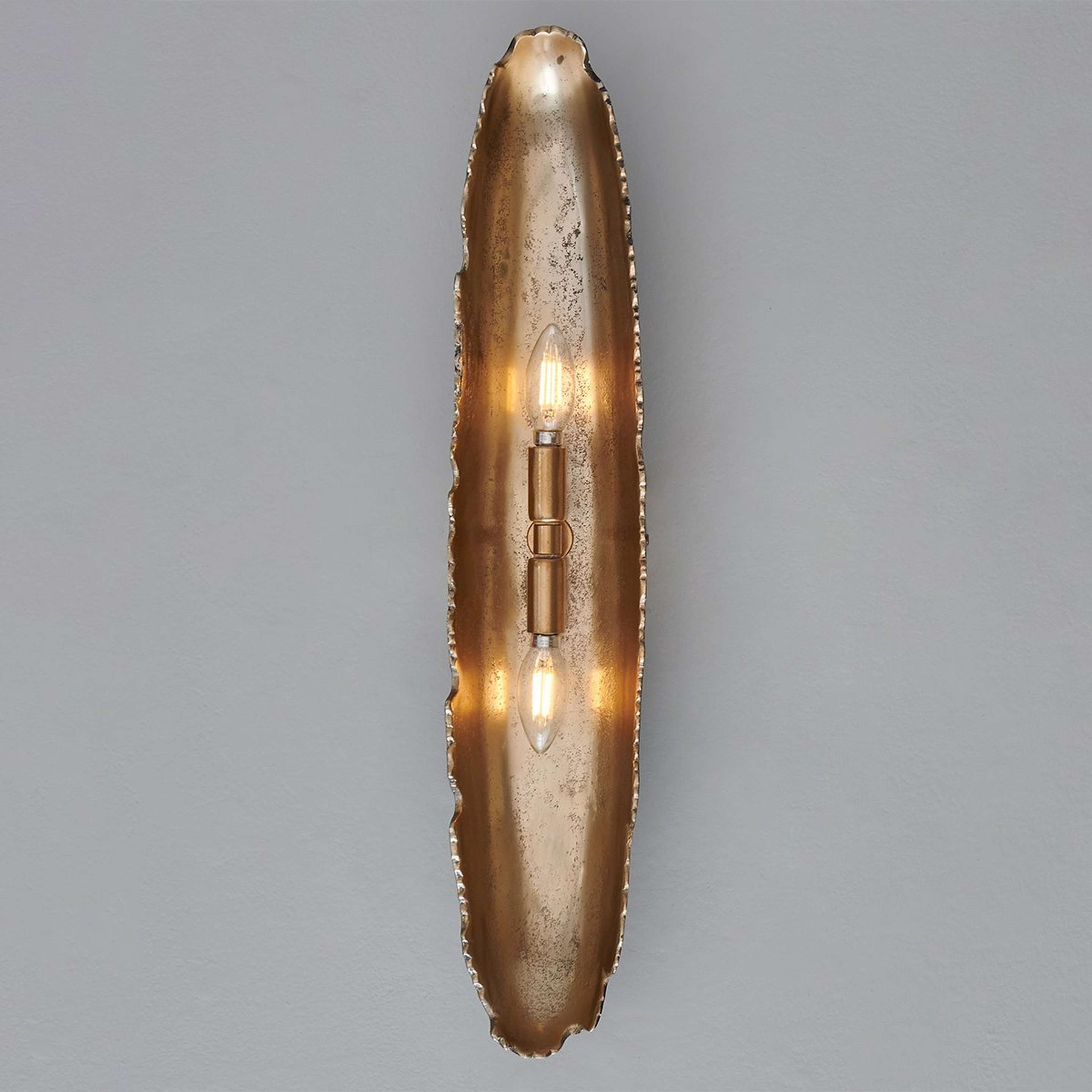 A Oumaumau Sconce with Pewter / Gold color