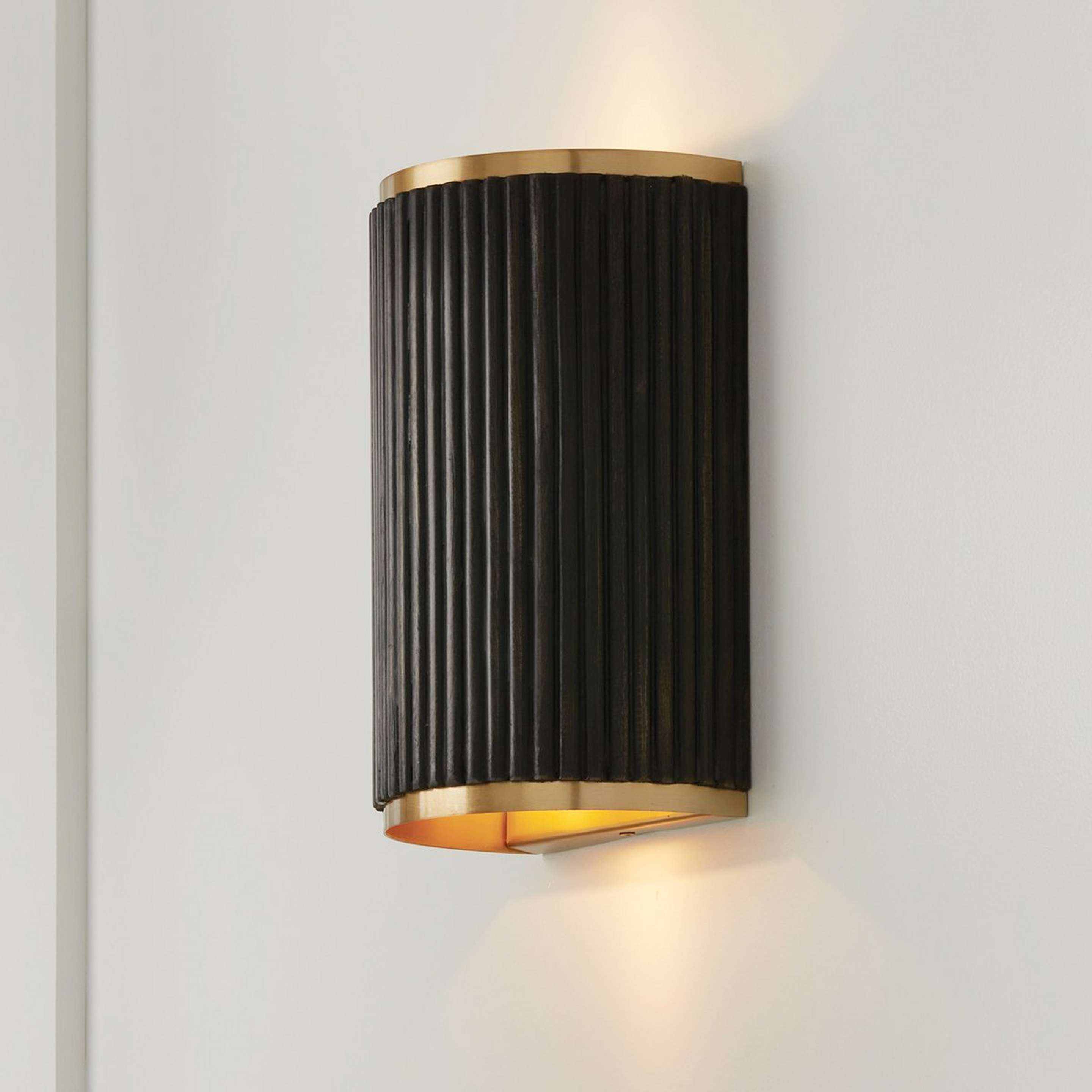A Chavis Sconce with Aged Brass / Black Wood Stain color