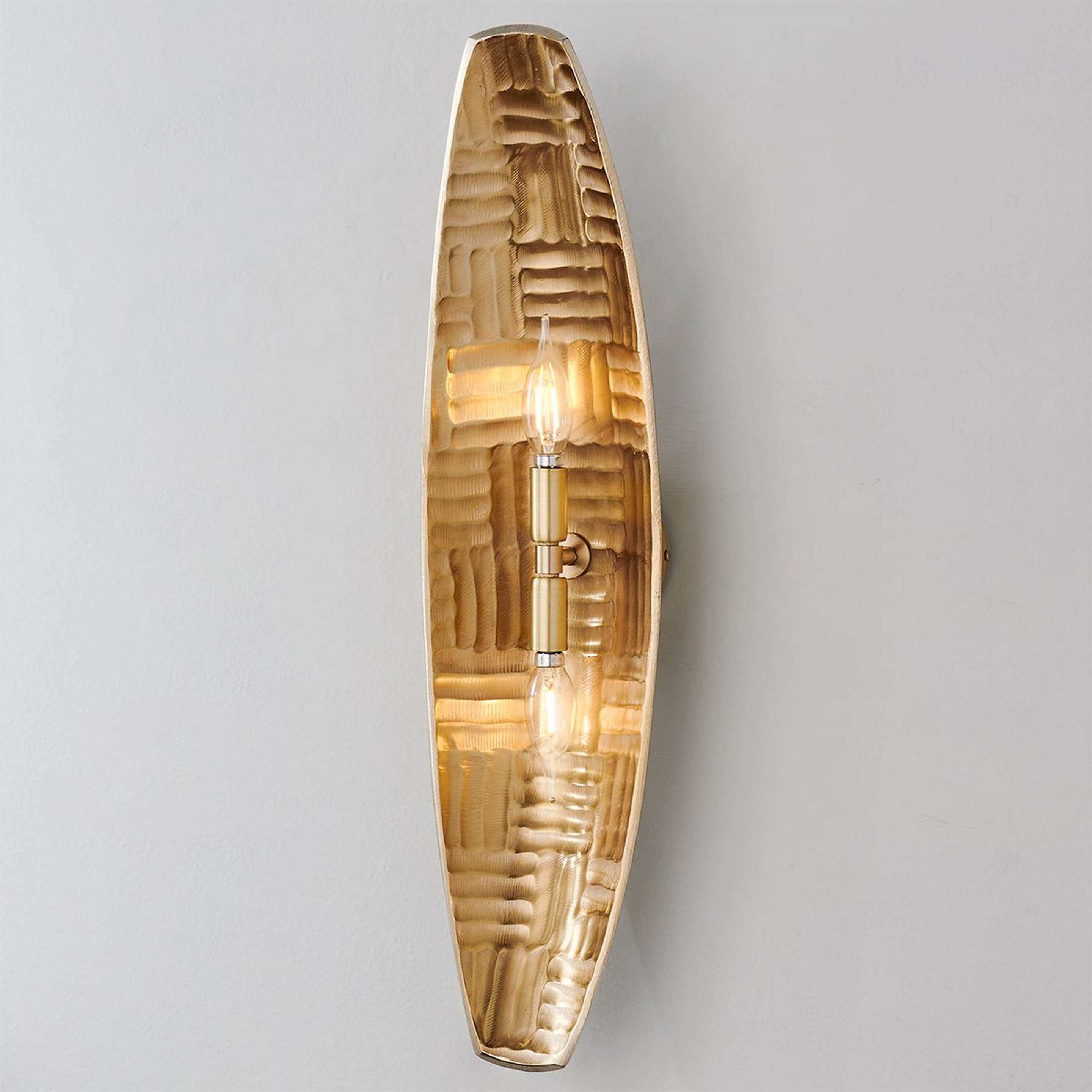 A Phorj Sconce with Satin Brass color