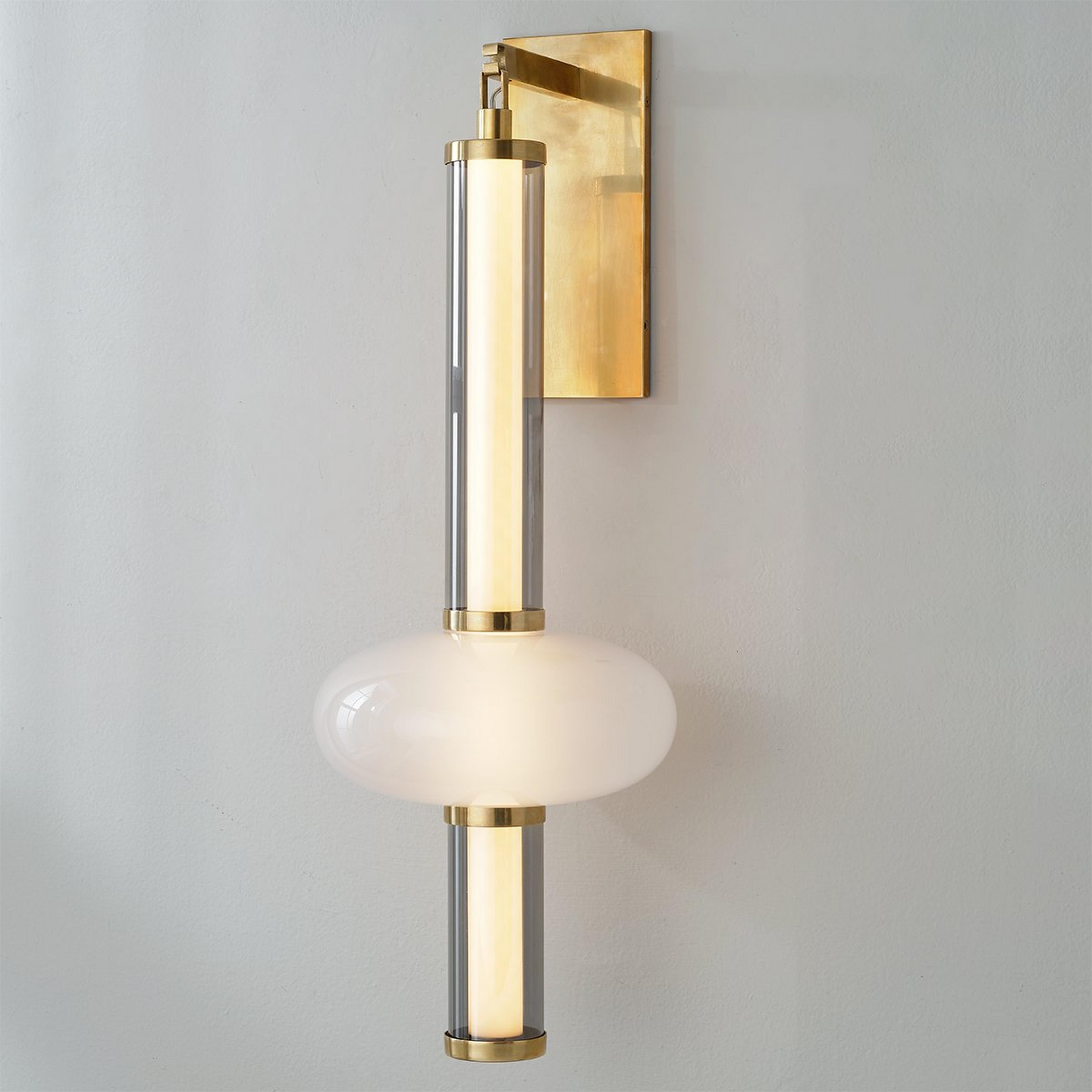 A Gig Harbor Sconce with Antique Brass / White Glass / Clear Glass  color