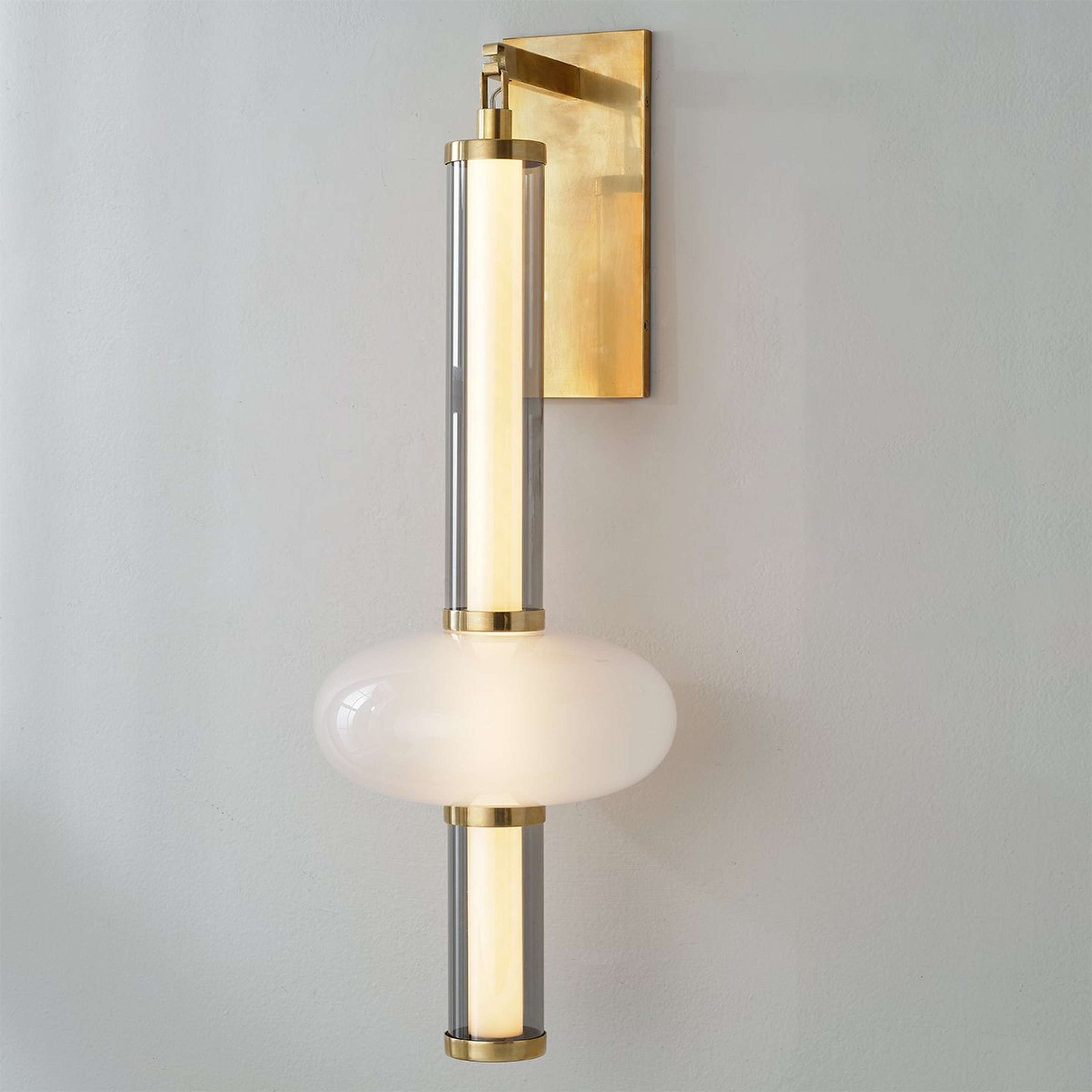 A Gig Harbor Sconce with Antique Brass / White Glass / Clear Glass color