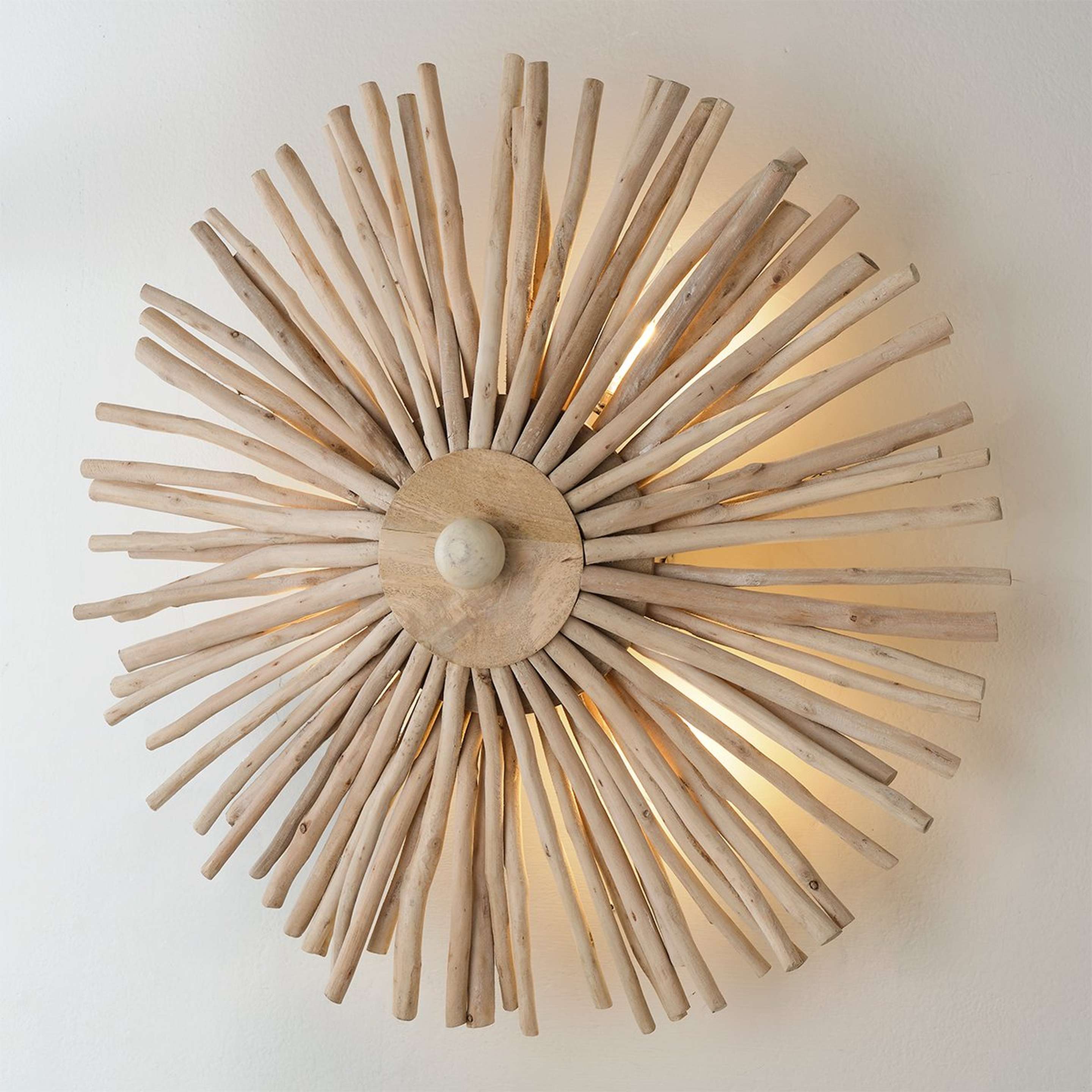 A Comari Sconce with White Washed Wood color