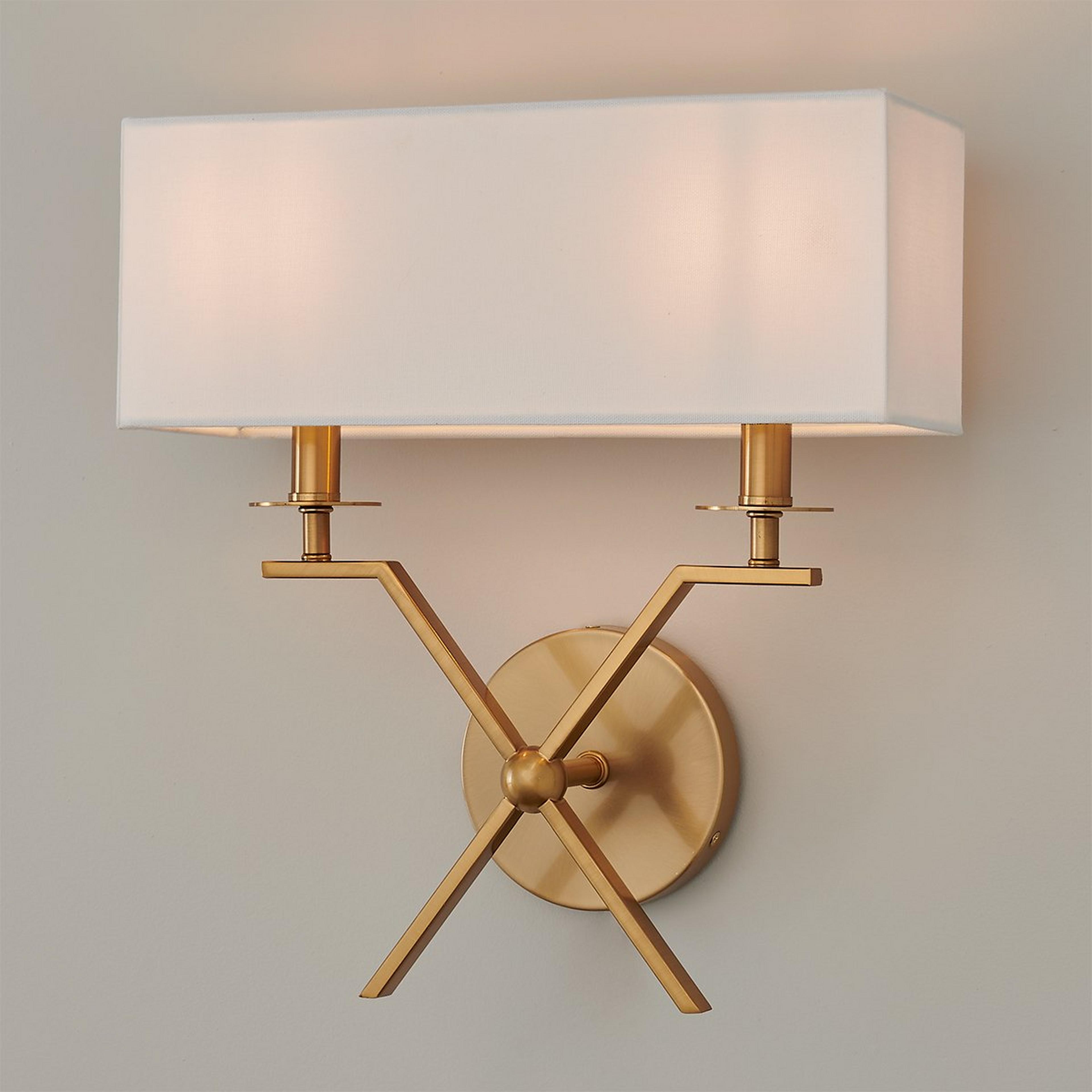 A Xiadani Sconce with Aged Brass color