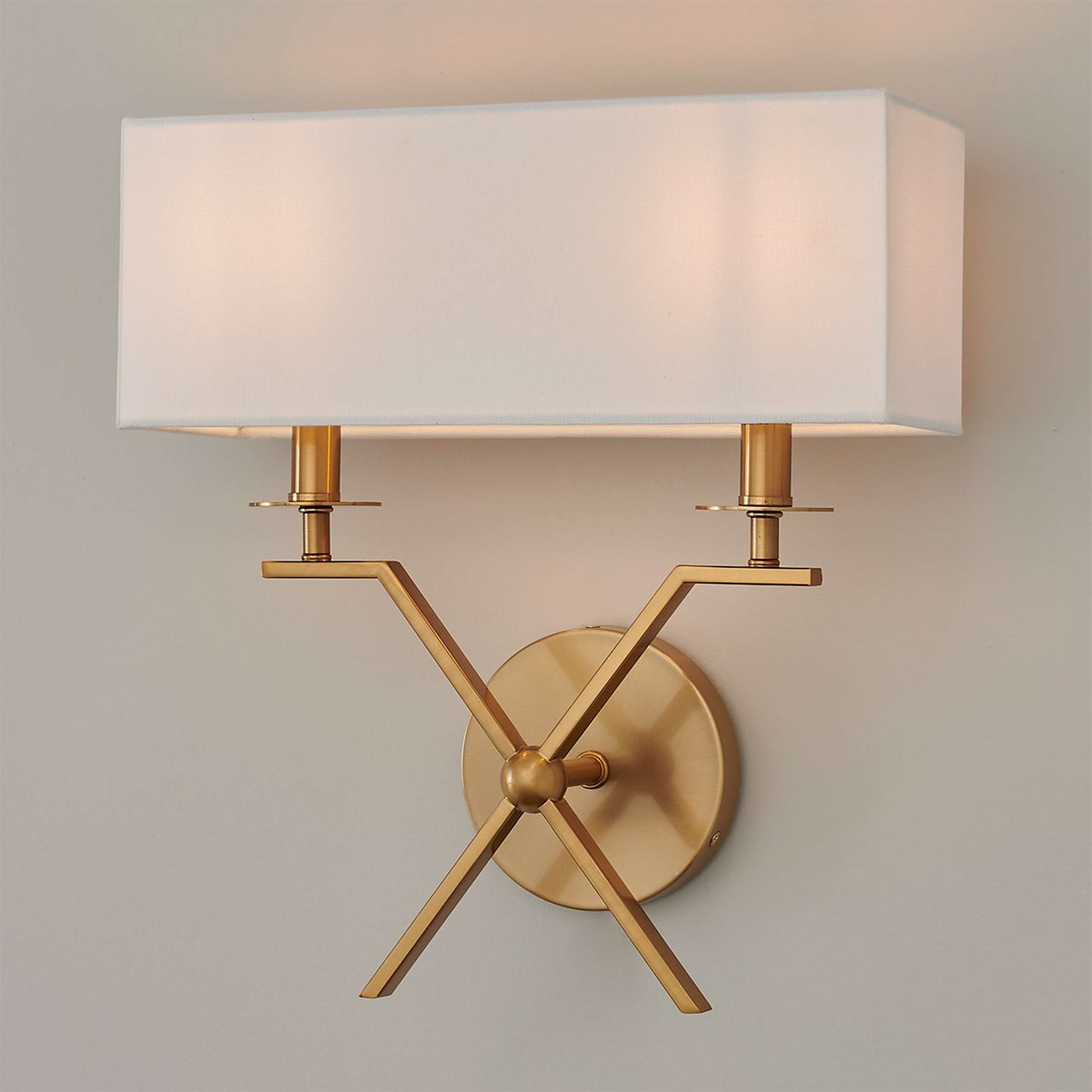 A Xiadani Sconce with Aged Brass color