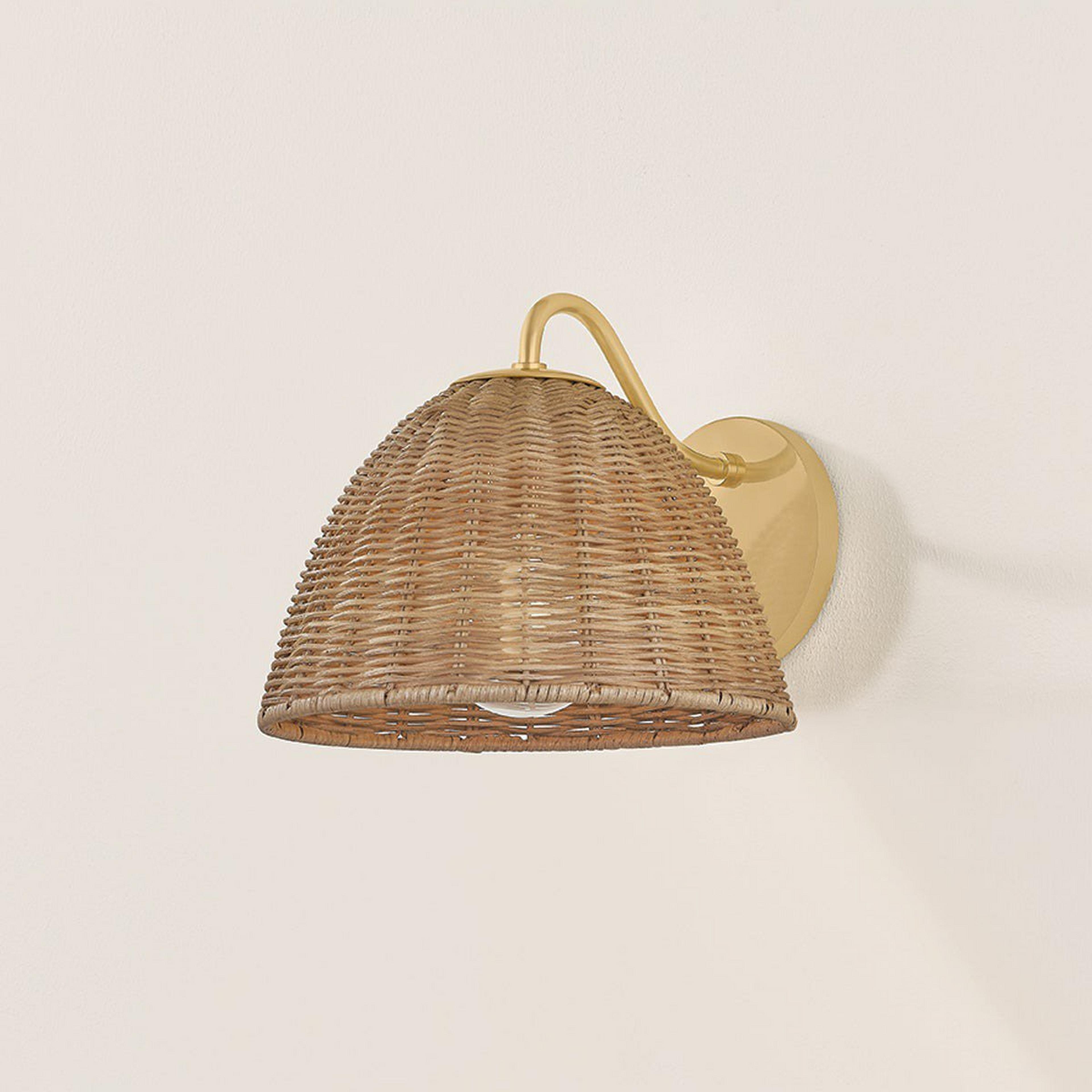 A Marathos Sconce with Brass / Natural Wicker color