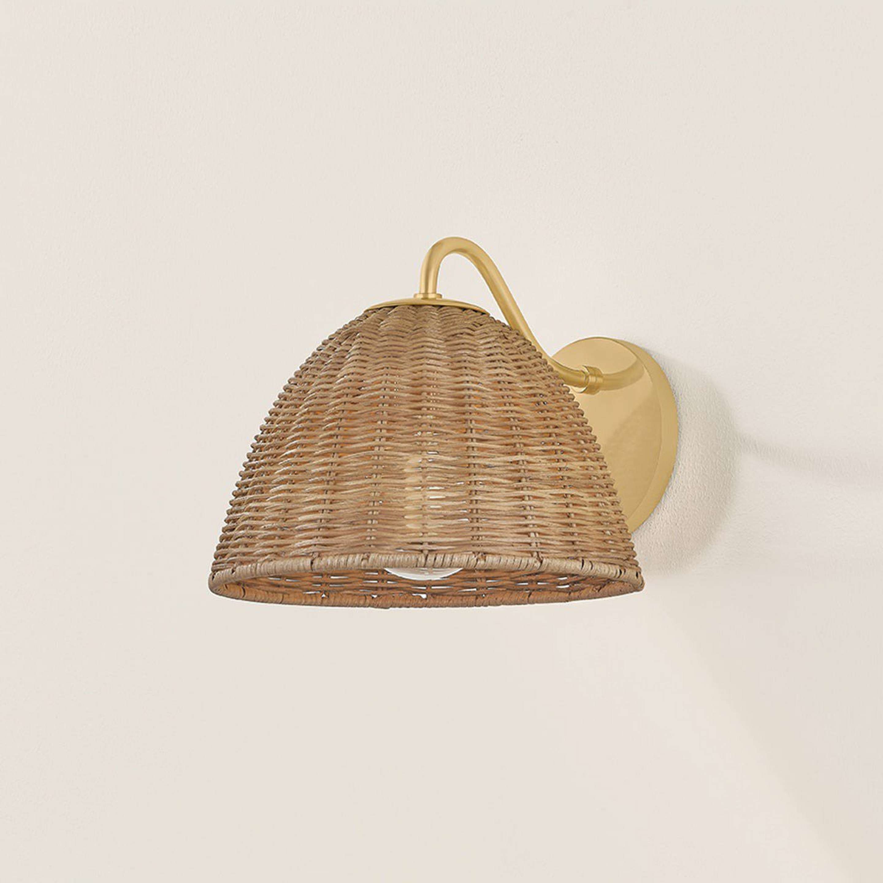 A Marathos Sconce with Brass / Natural Wicker color