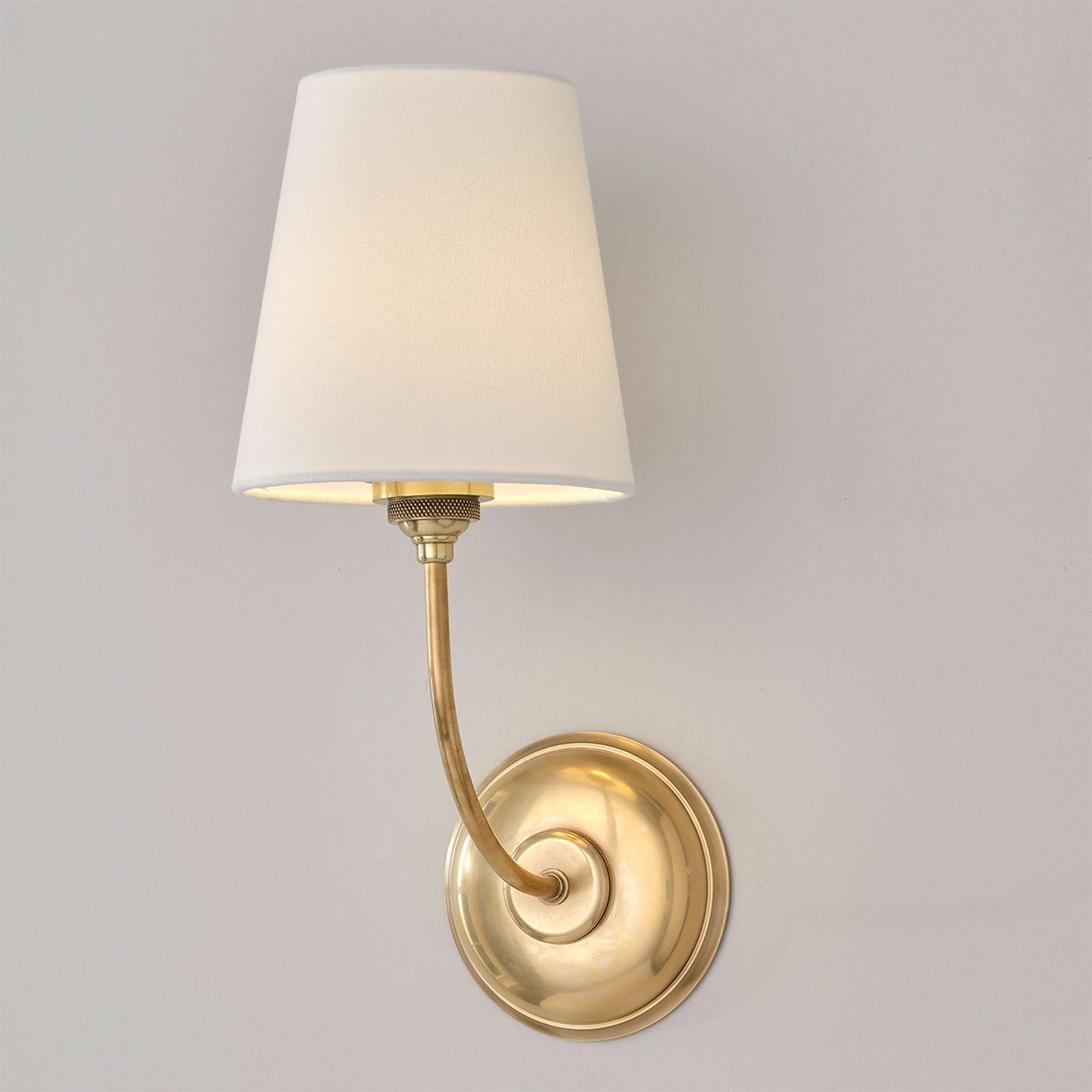 A Montclair Rechargeable LED Cordless Sconce with Antique Brass color