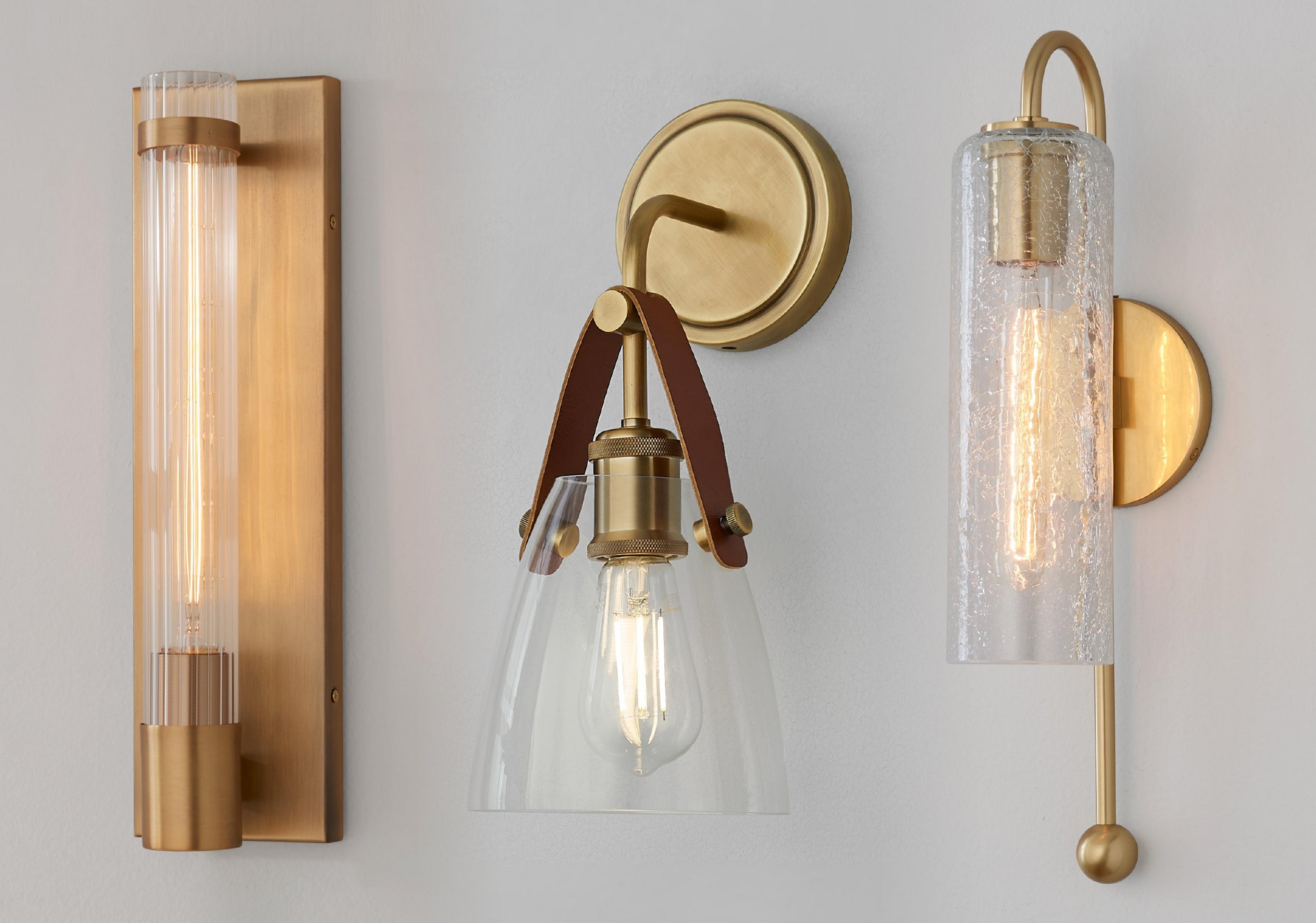 Collection of glass sconces on a gray wall