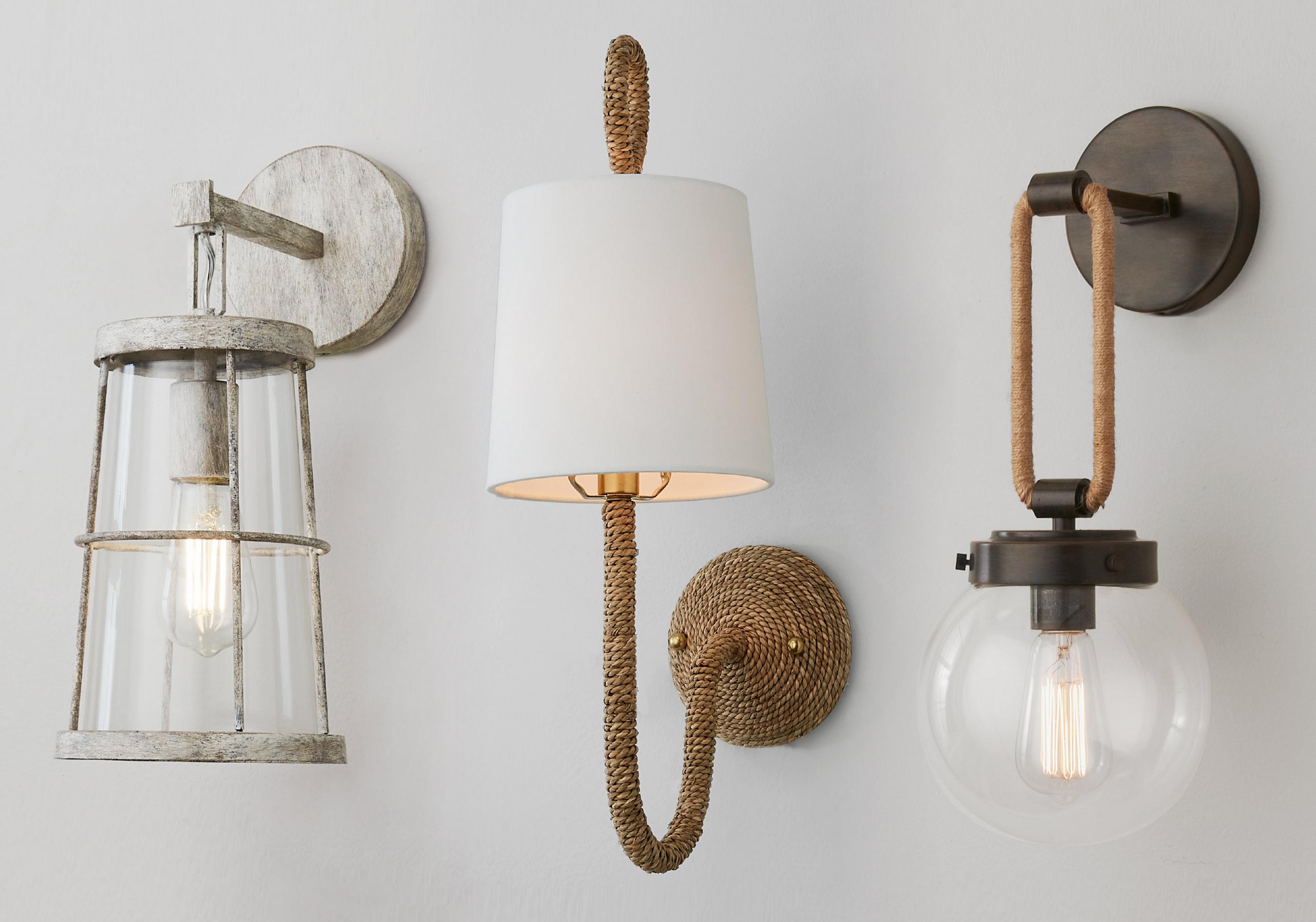 Three nautically inspired sconce on a gray wall
