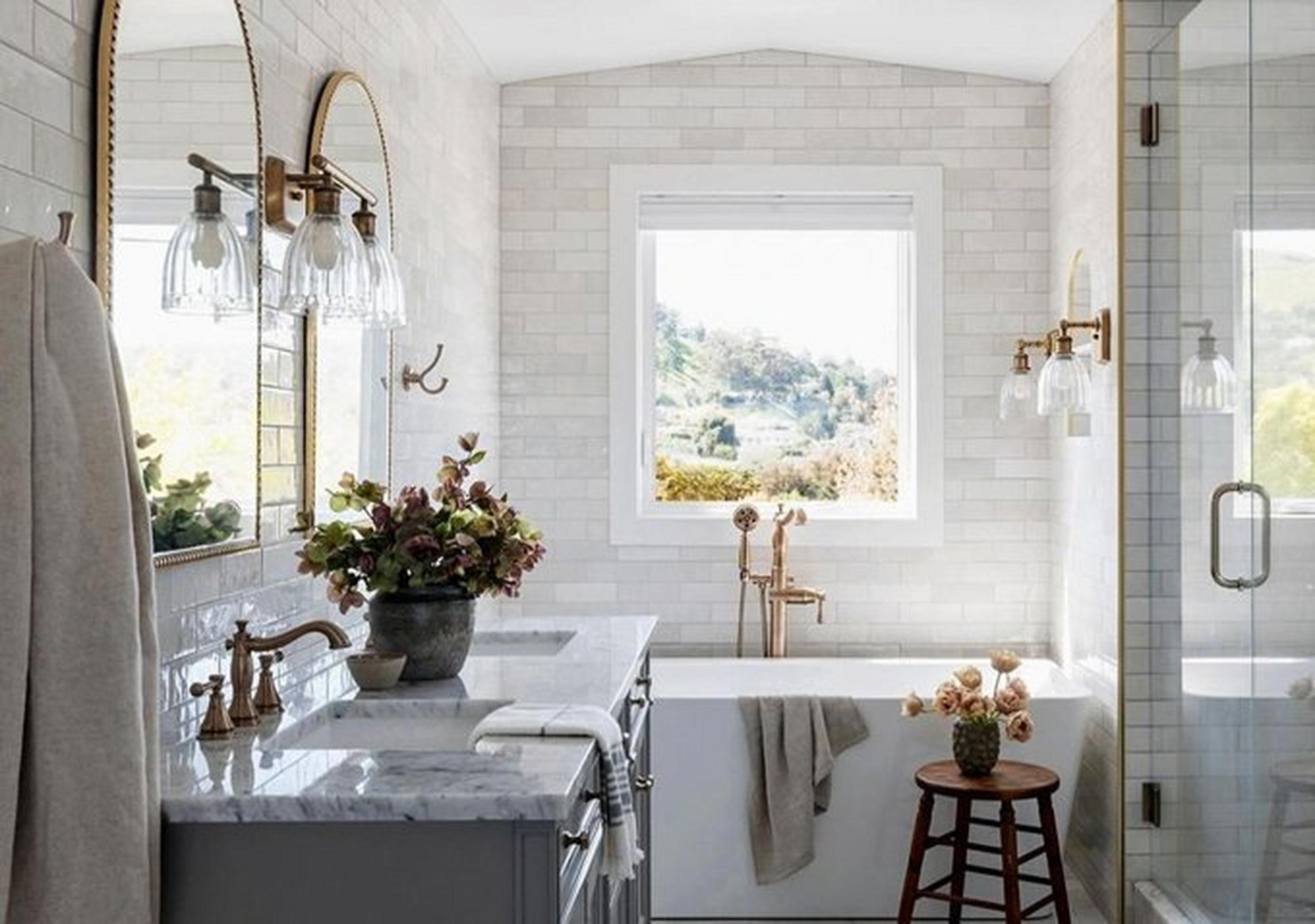 Bathroom with subway tile and gold fixtures