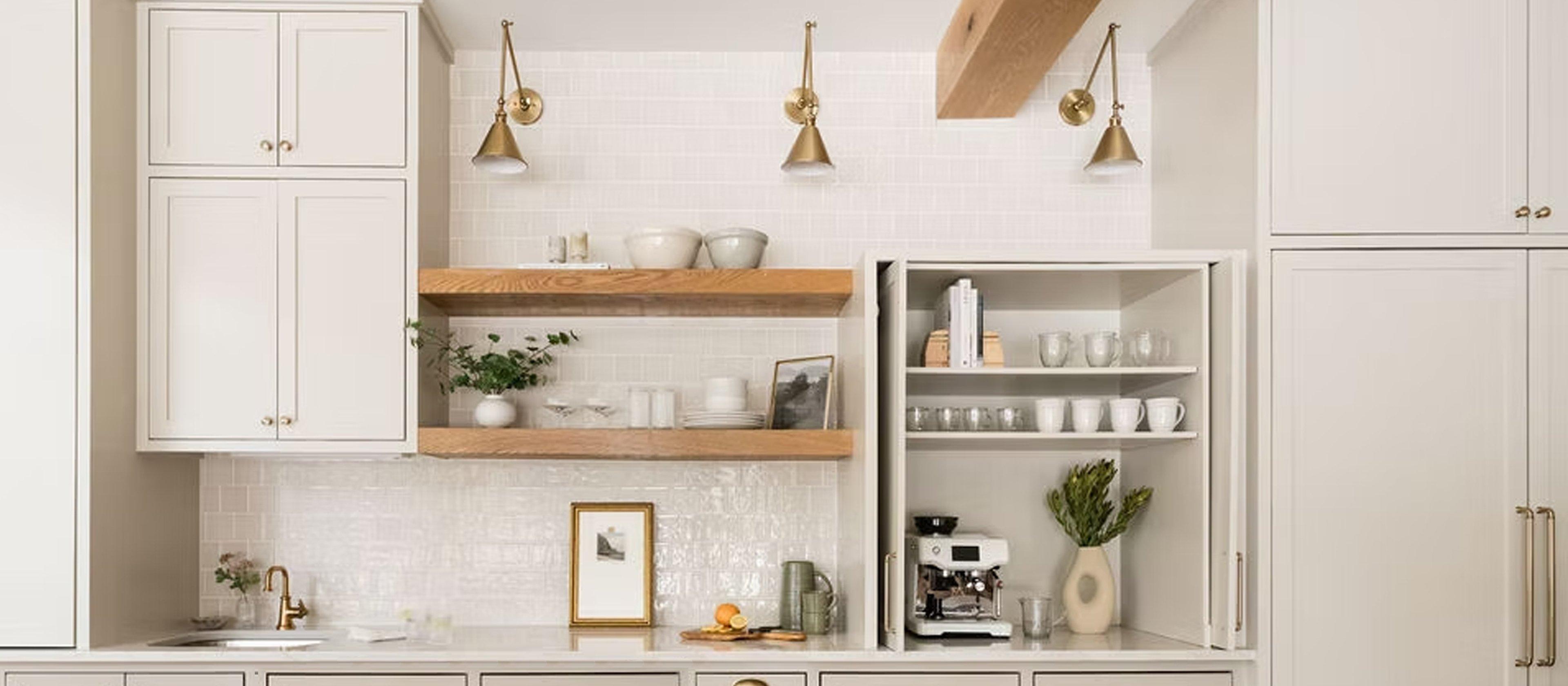 Neutral Kitchen with antique brass swing arm wall lights