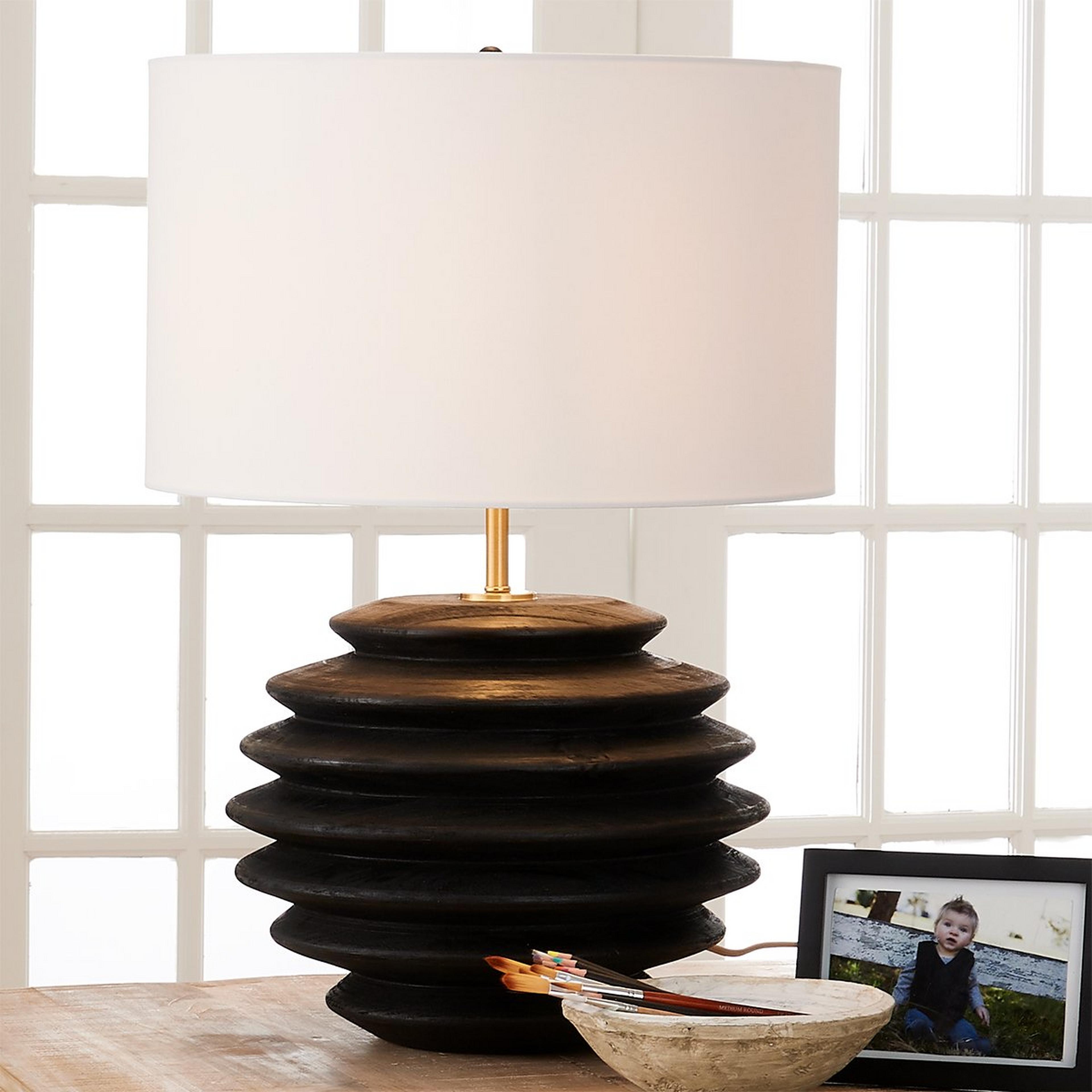 A Rocio Table Lamp with Black Wood color
