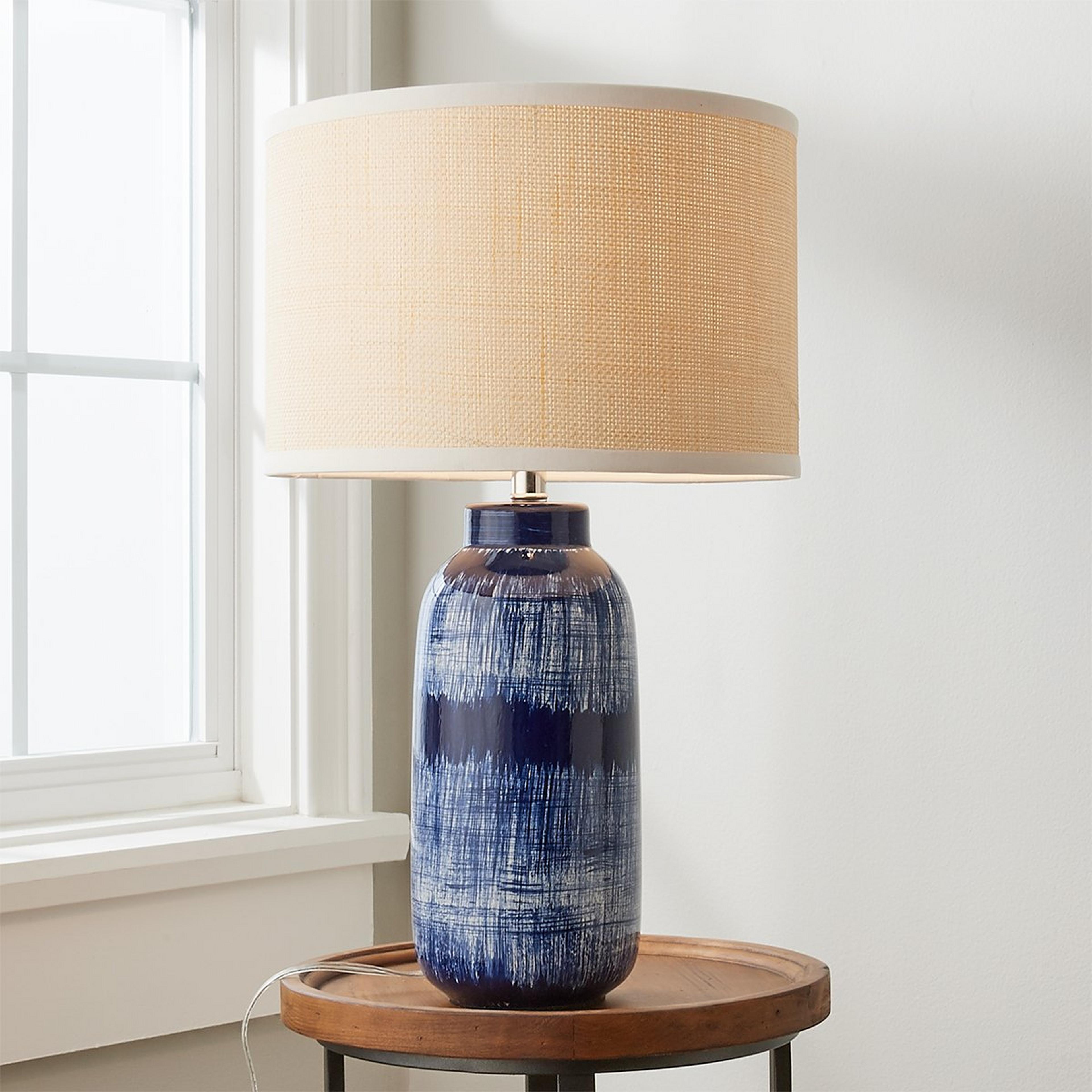A Rialto Table Lamp with Navy / Blue / Ivory / Raffia color