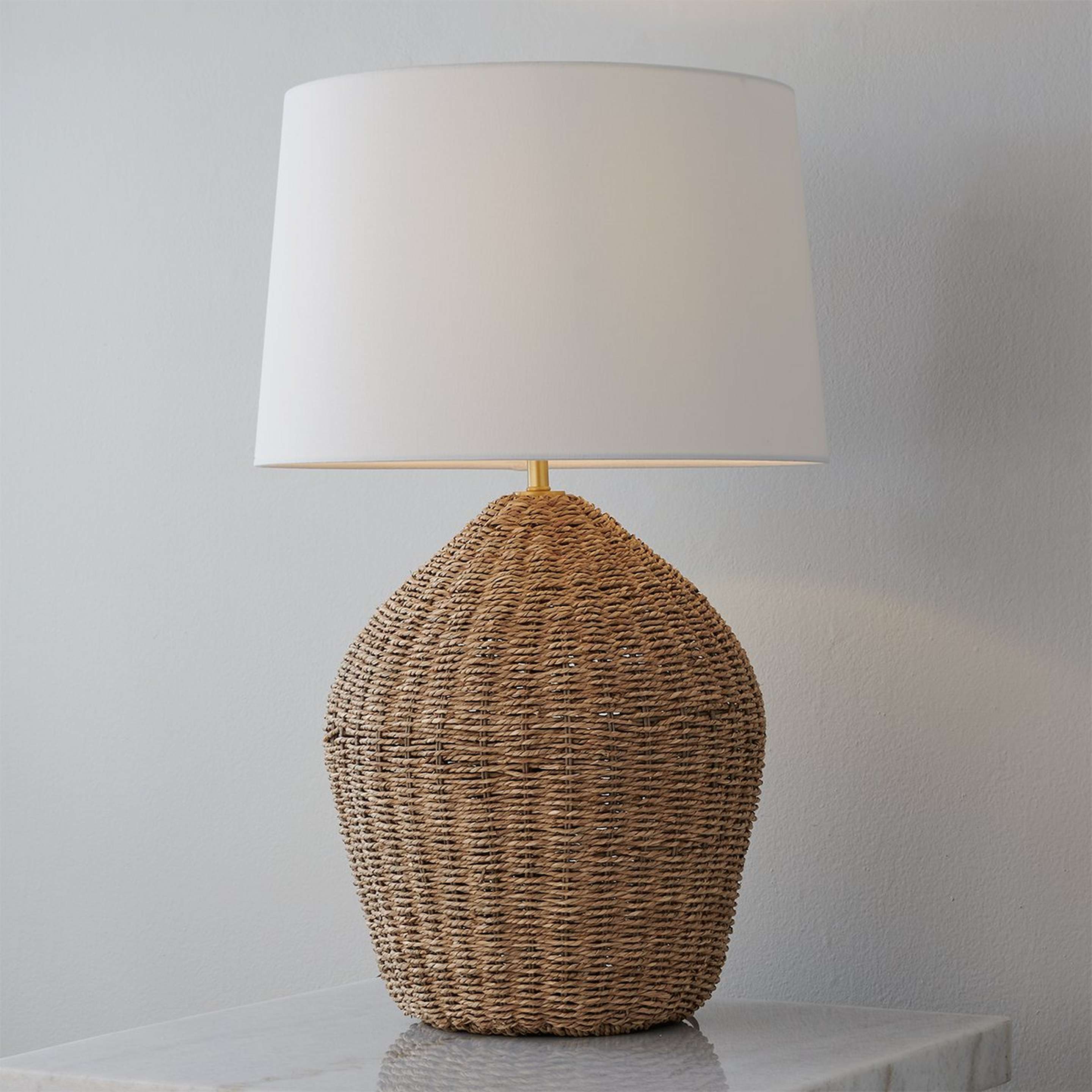 A Coastal Kayla Table Lamp with Natural Rattan color