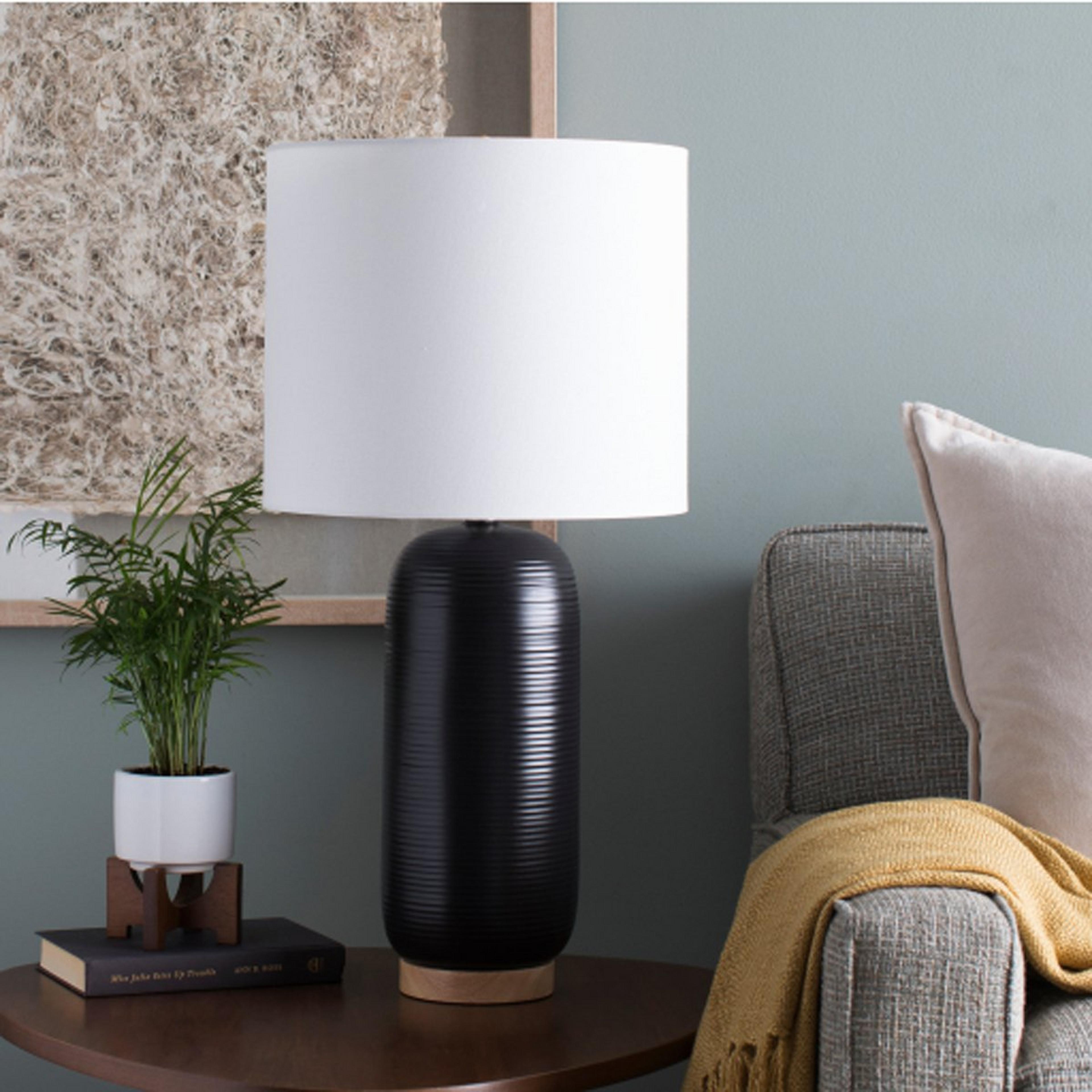 A Kristoff Table Lamp with Black color