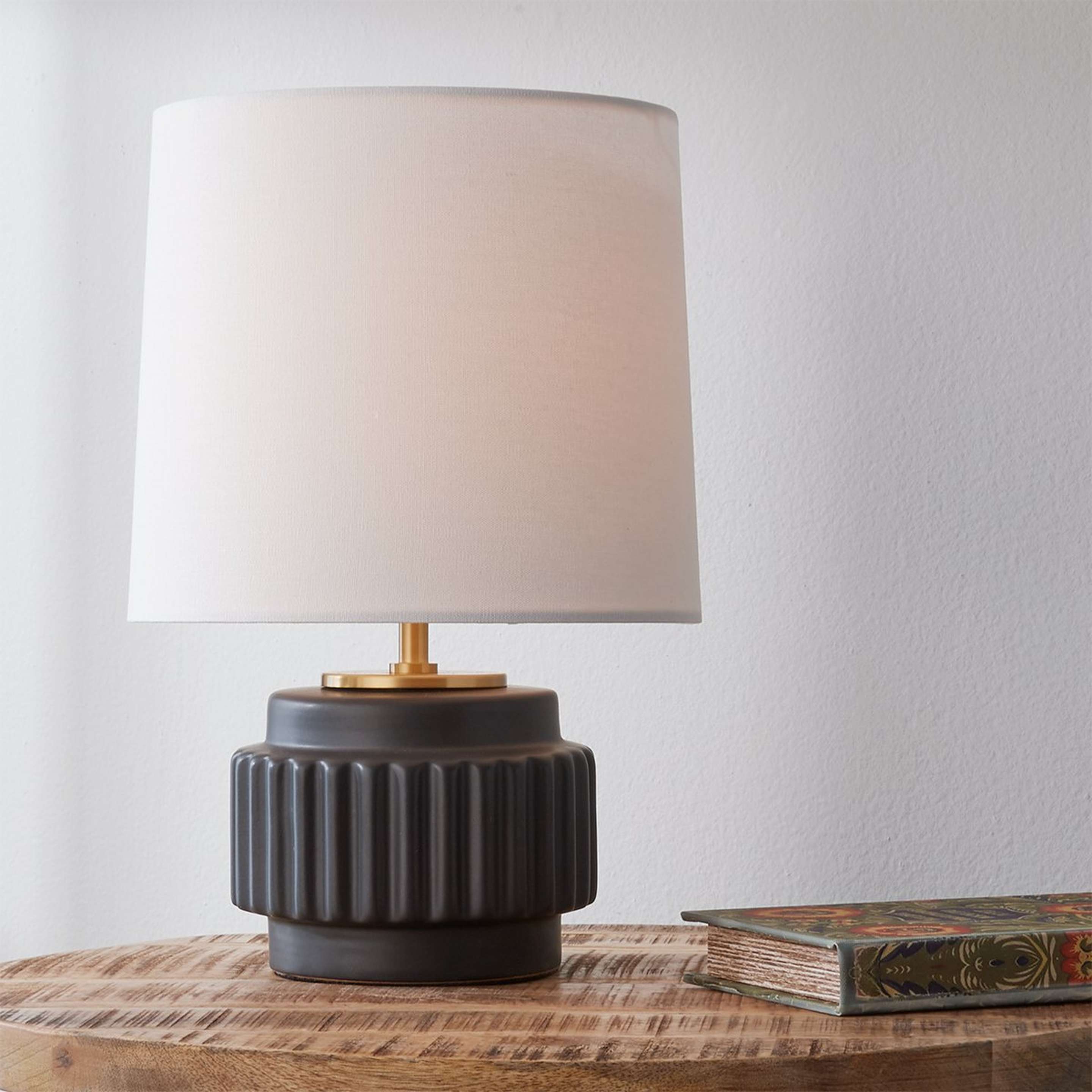 A Melton Table Lamp with Matte Black / Brass Detail color