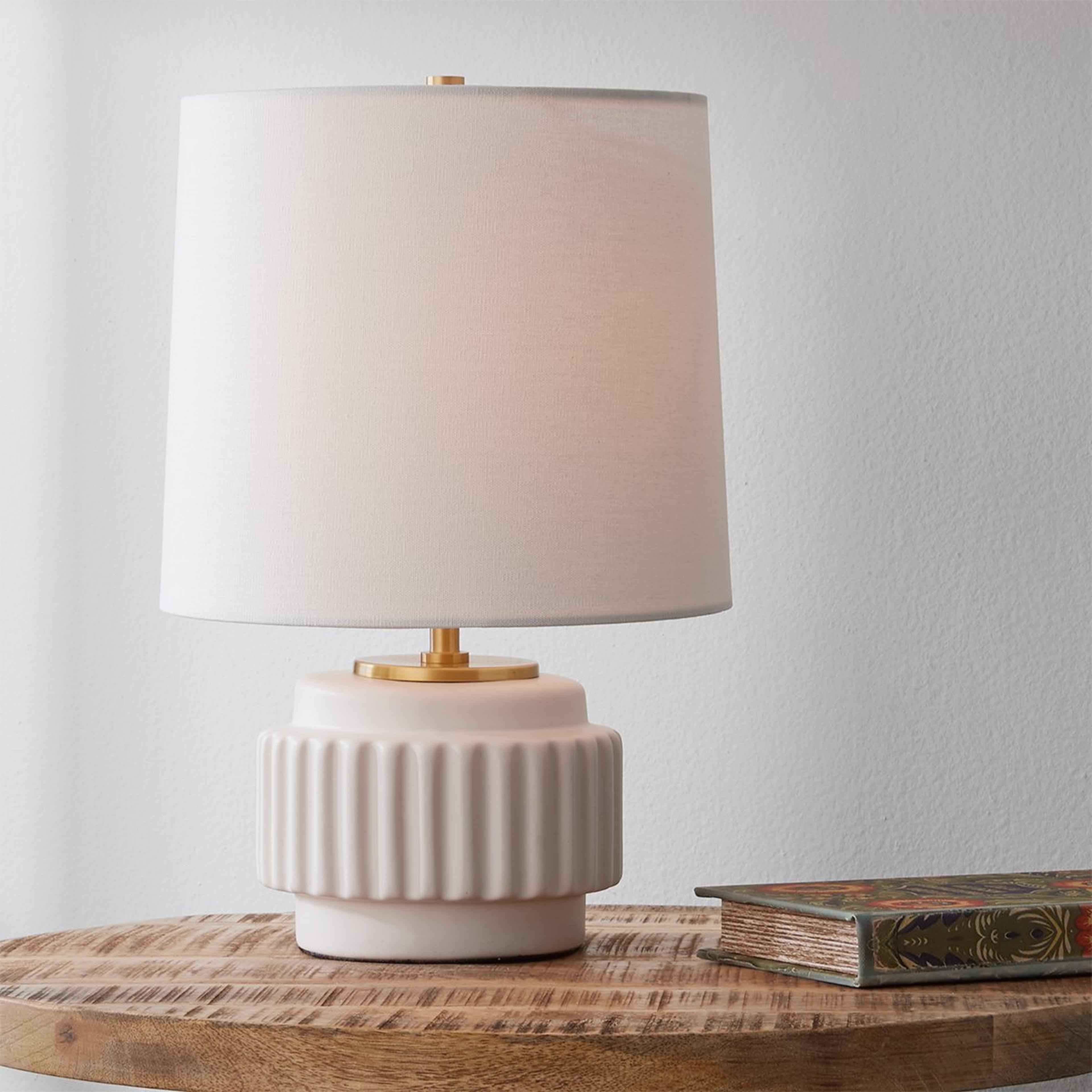 A Melton Table Lamp with Matte White / Brass Detail color