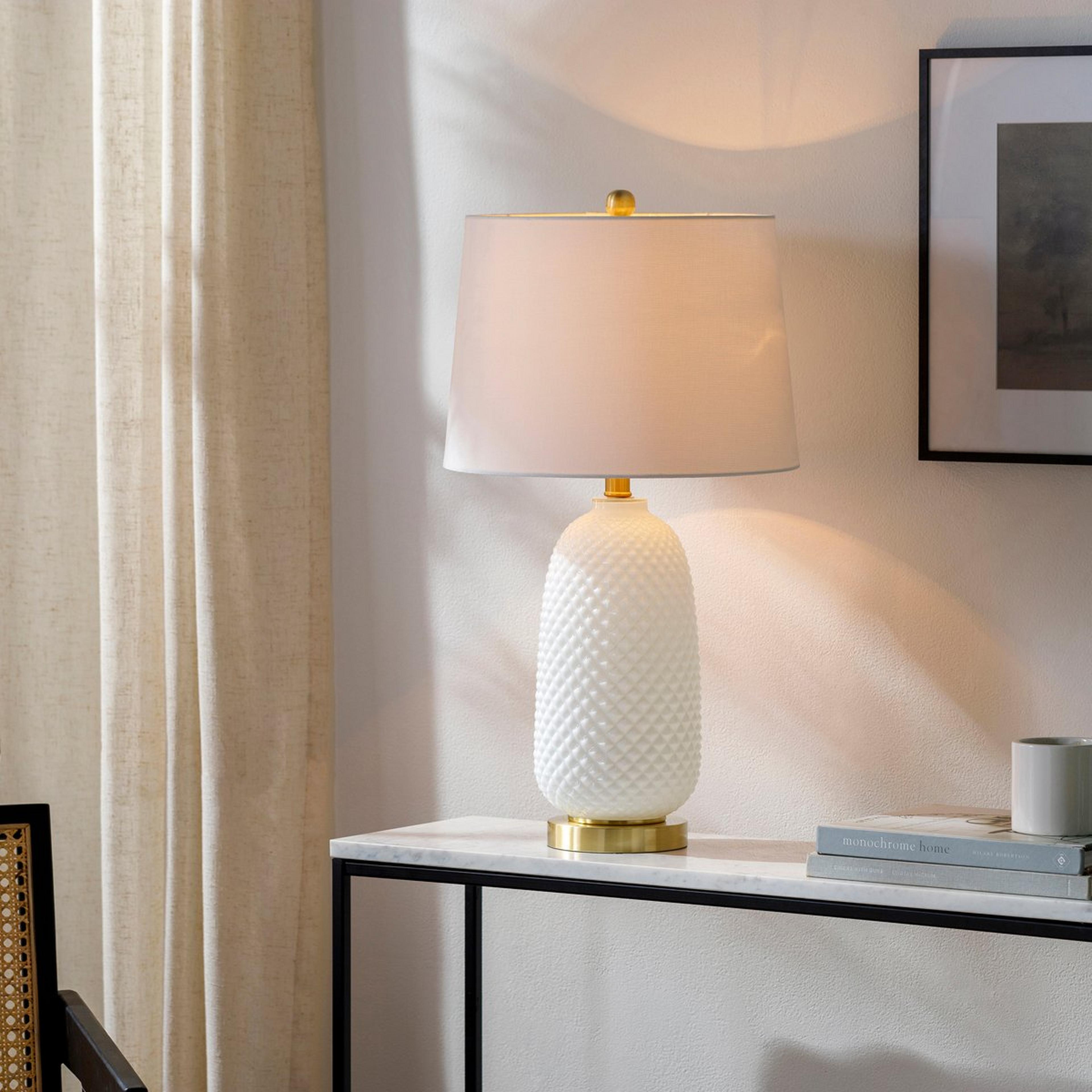 A Natalina Table Lamp with Textured White / Gold  color