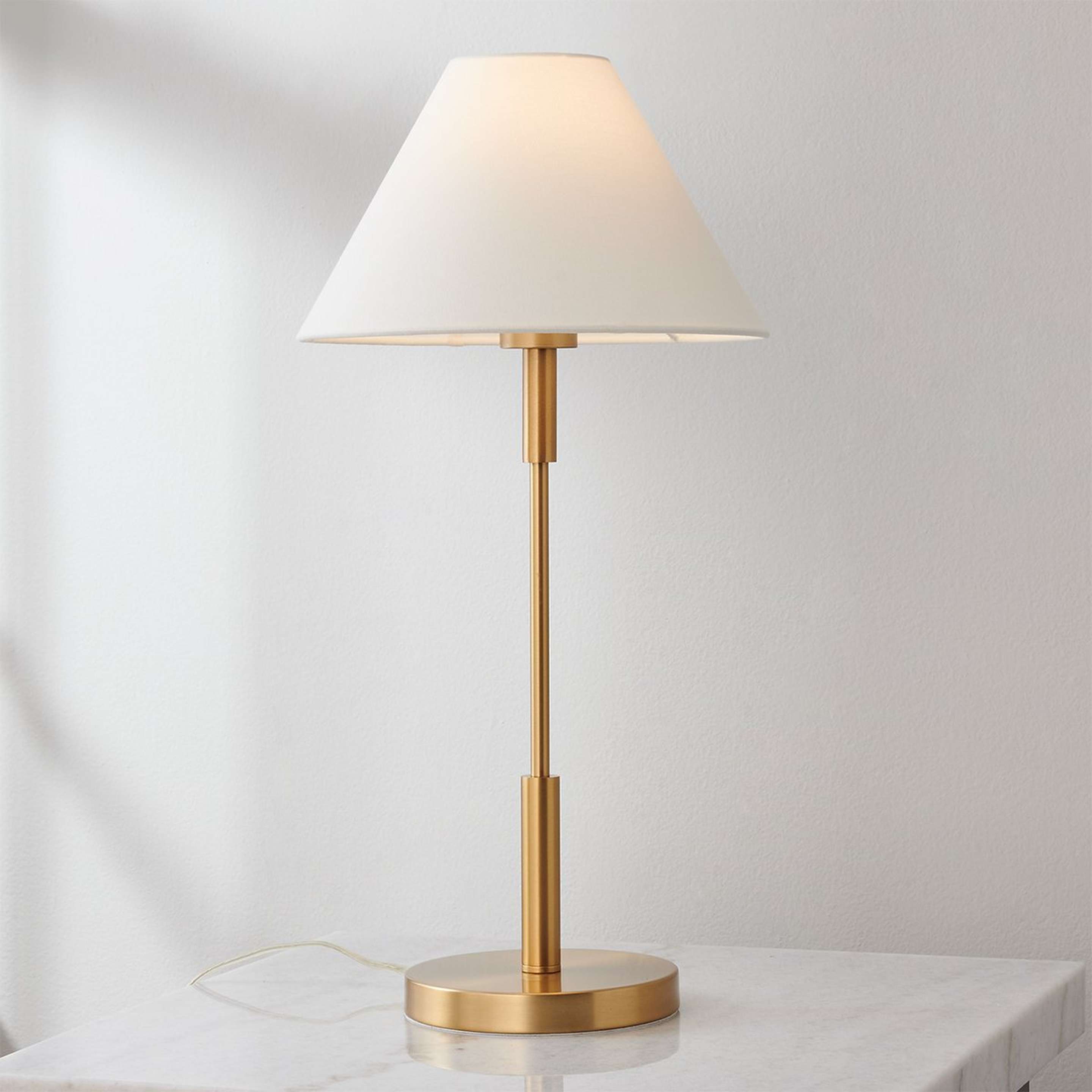 A Porteau Table Lamp with Satin Brass color