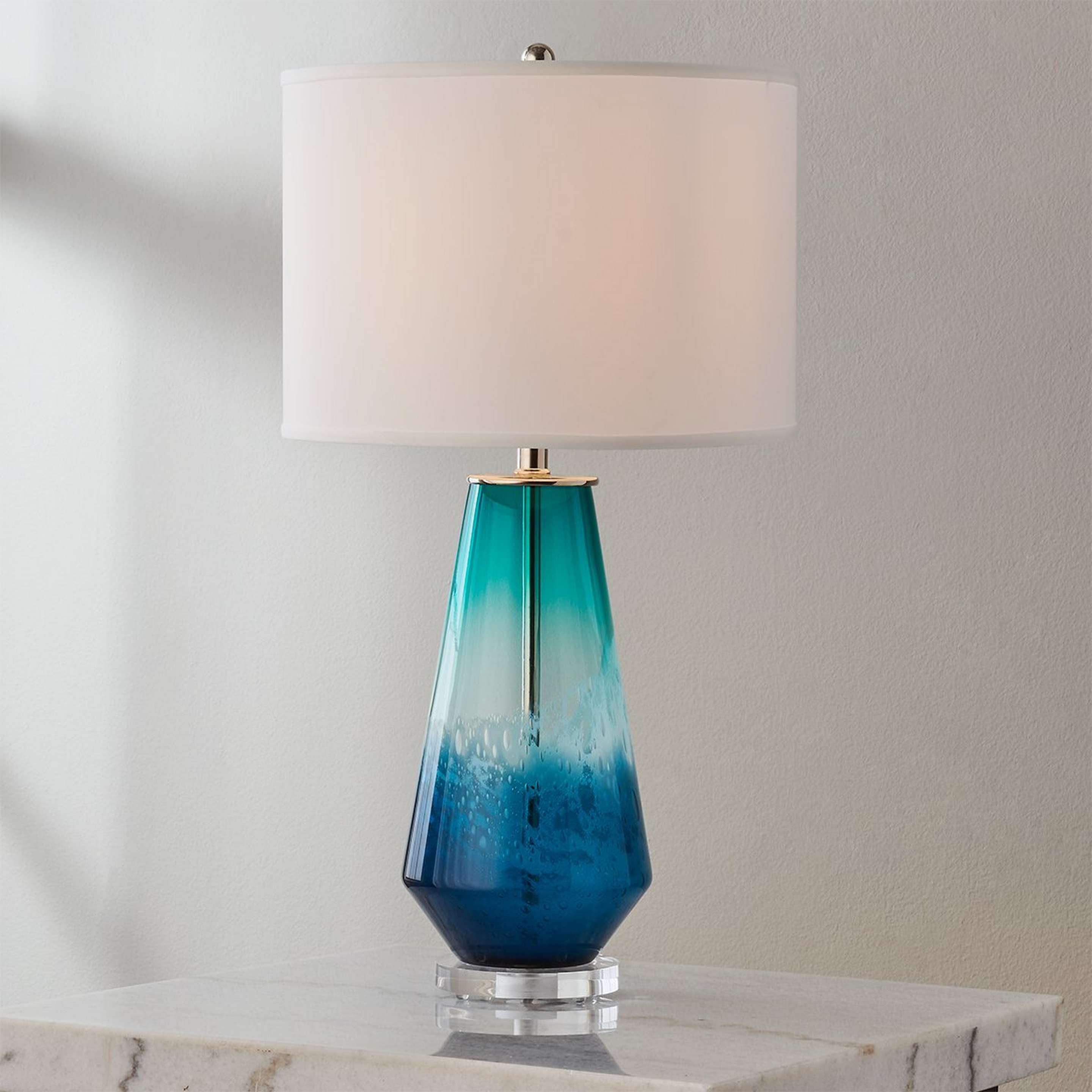 A Rockland Table Lamp with Blue / White color