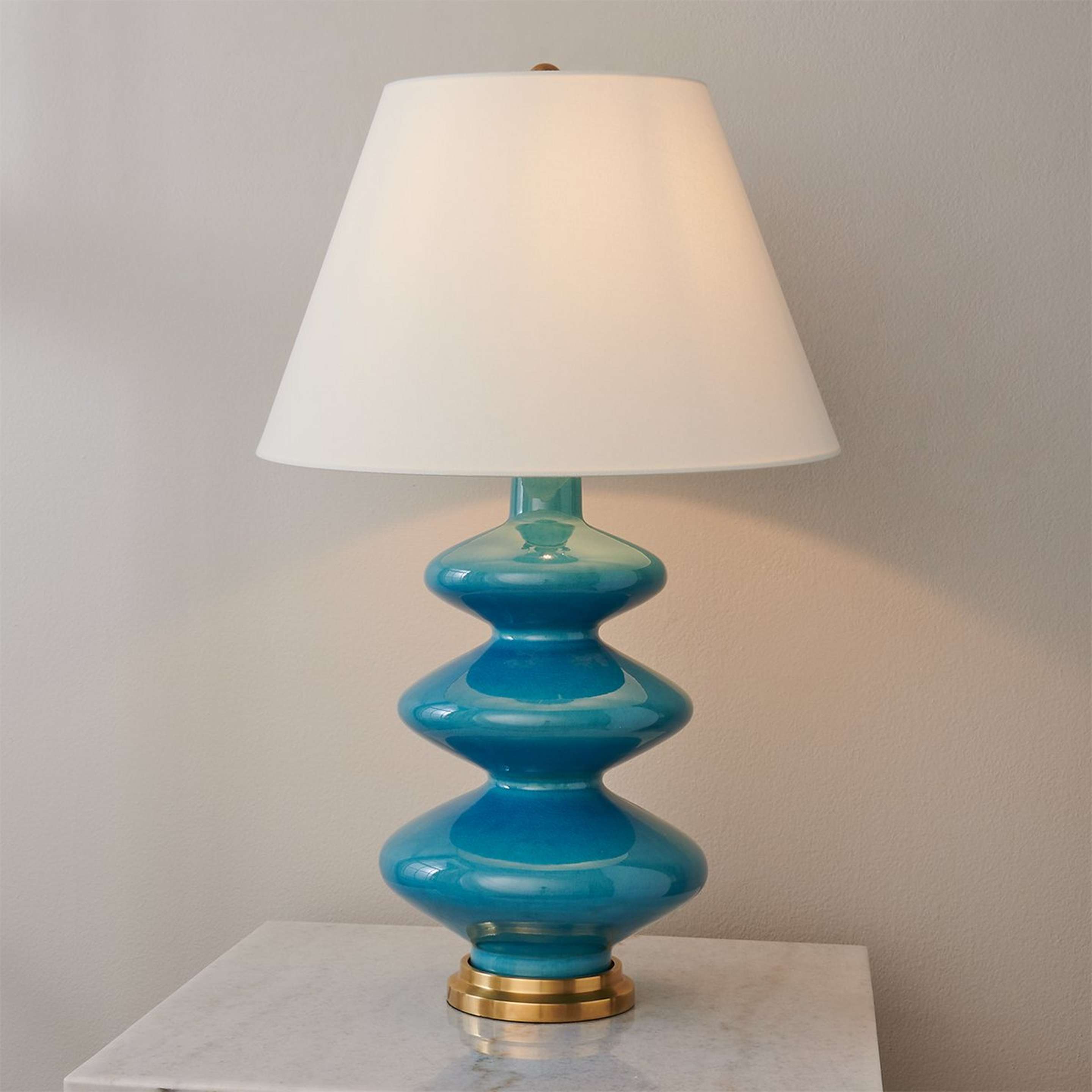 A Lenox Table Lamp with Blue / Brown / Brass color