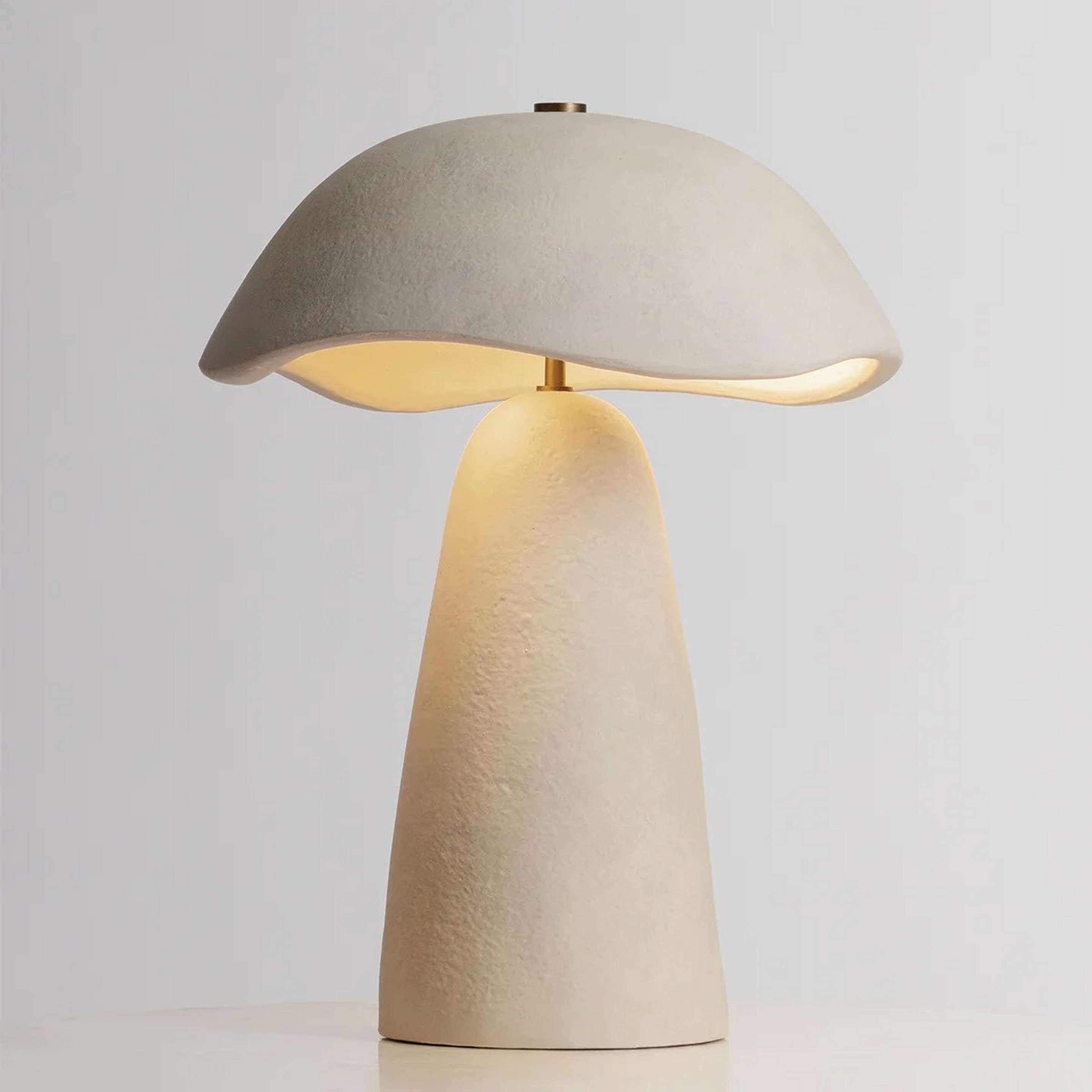 A Ushmil Table Lamp with Brass / Beige Ceramic color
