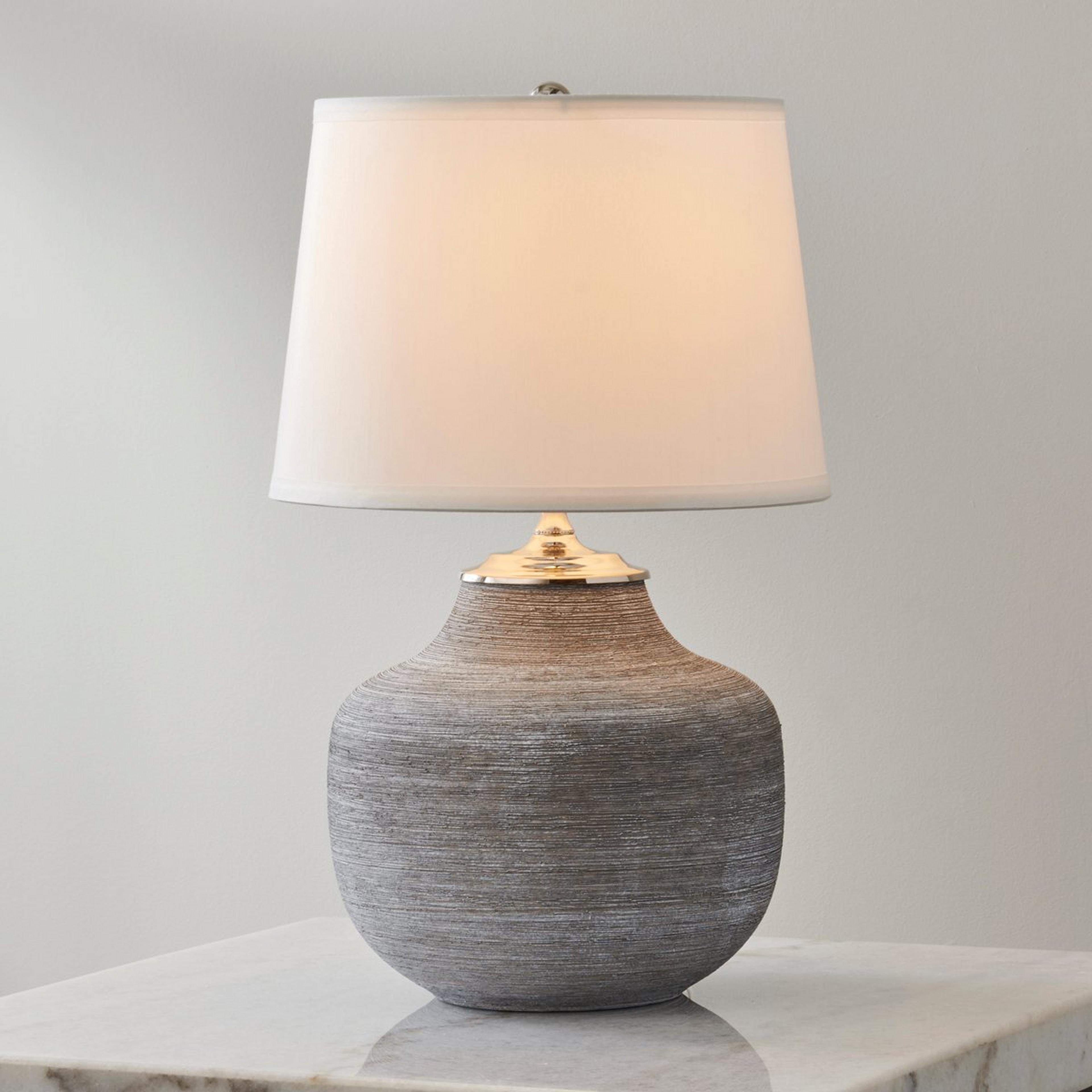 A Trompa Table Lamp with Gray / White color