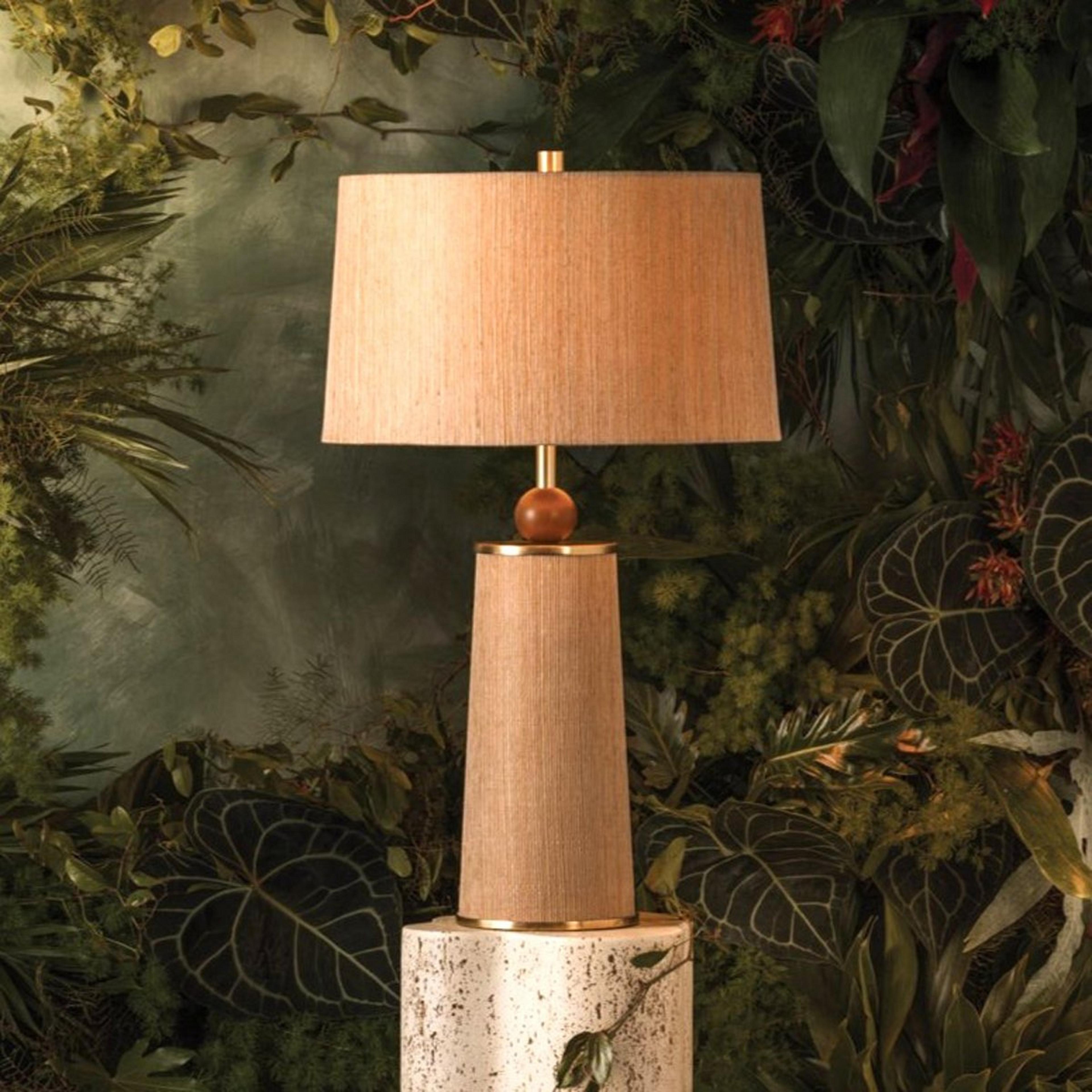 A Ursus Table Lamp with Brass / Natural Grasscloth / Wood color
