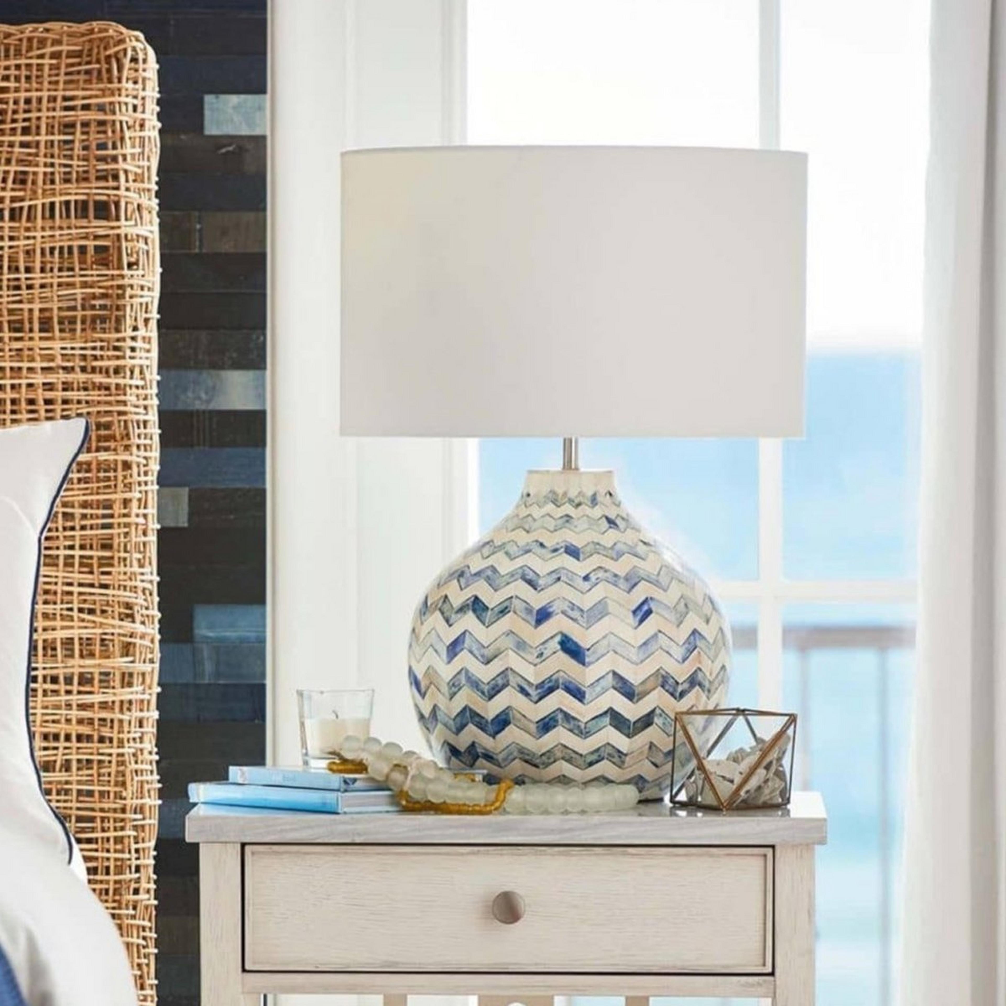 A Briarcliff Table Lamp with Brass / Blue / Natural Bone / White color