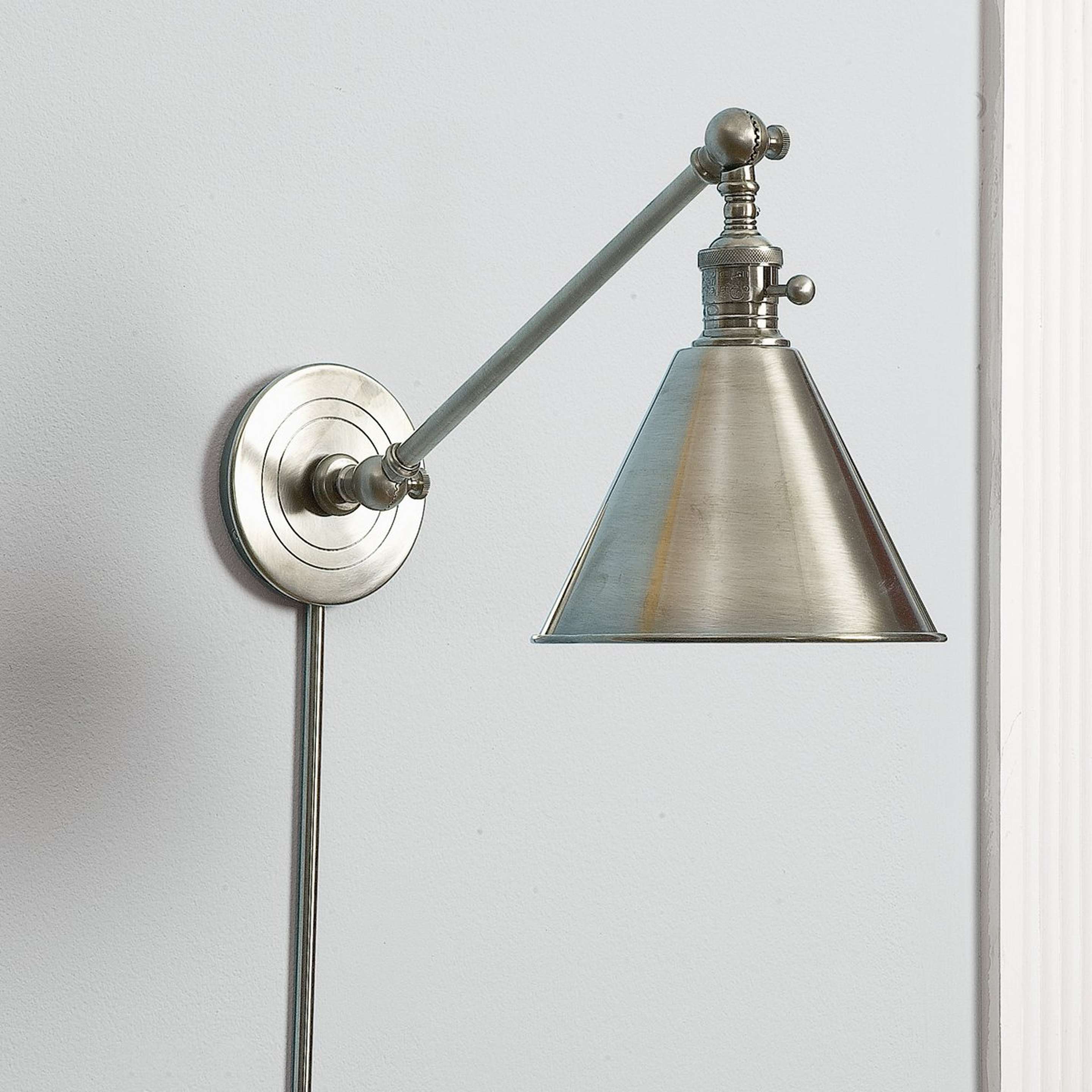 A Cone Pivot Shade Swing Arm with Antique Nickel color