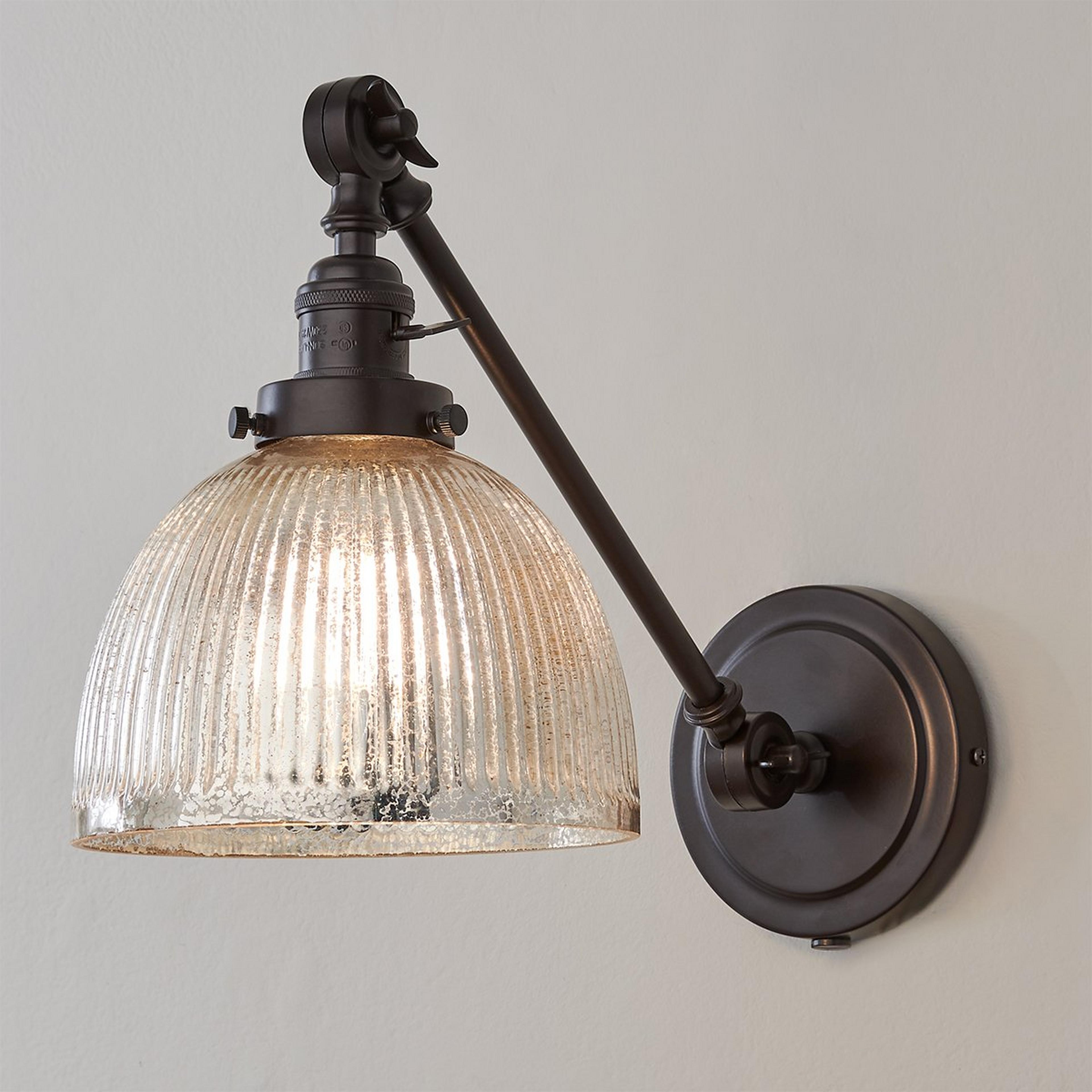 A Mercury Glass Dome Swivel Swing Arm with Oil Rubbed Bronze color