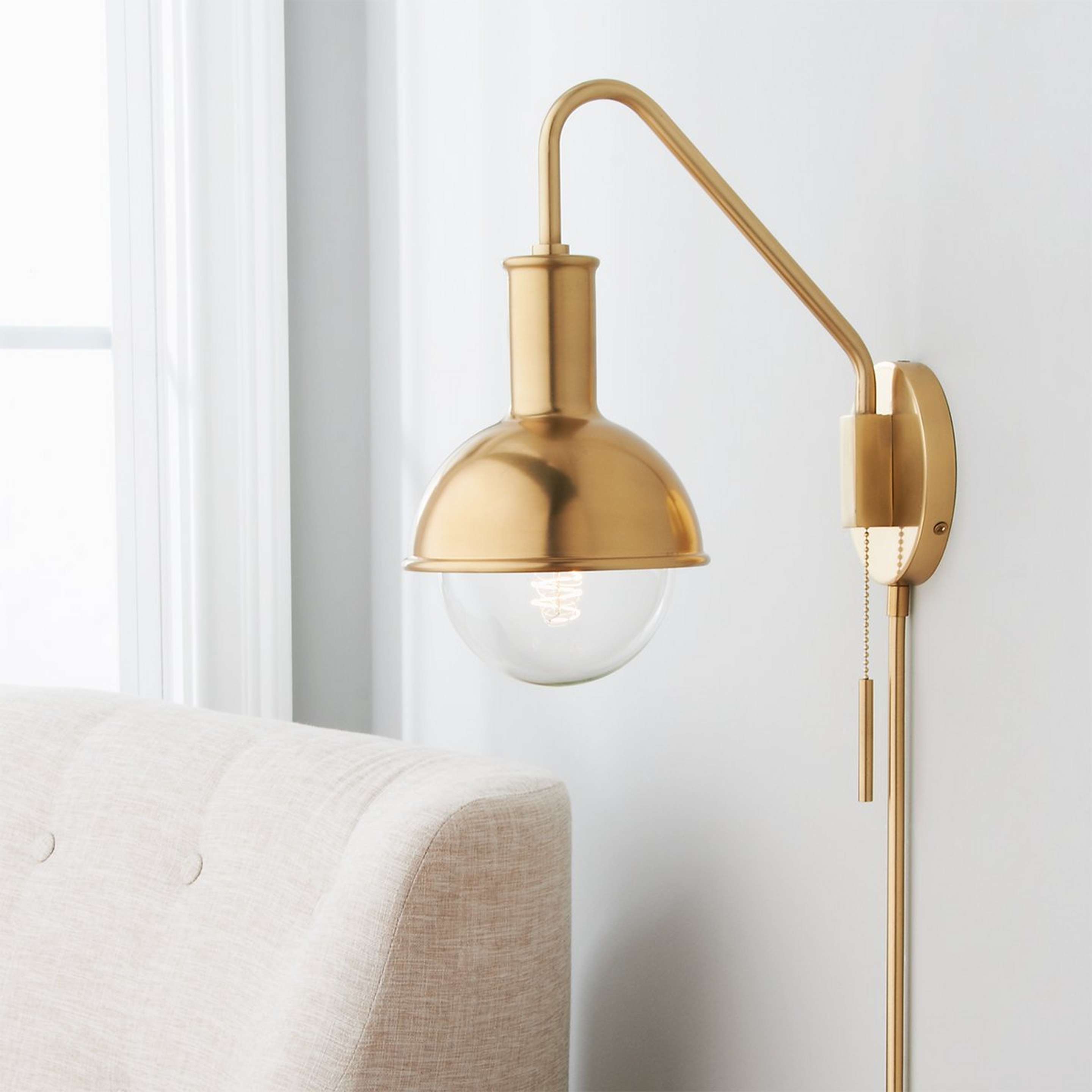 A Capped Globe Swing Arm with Aged Brass color