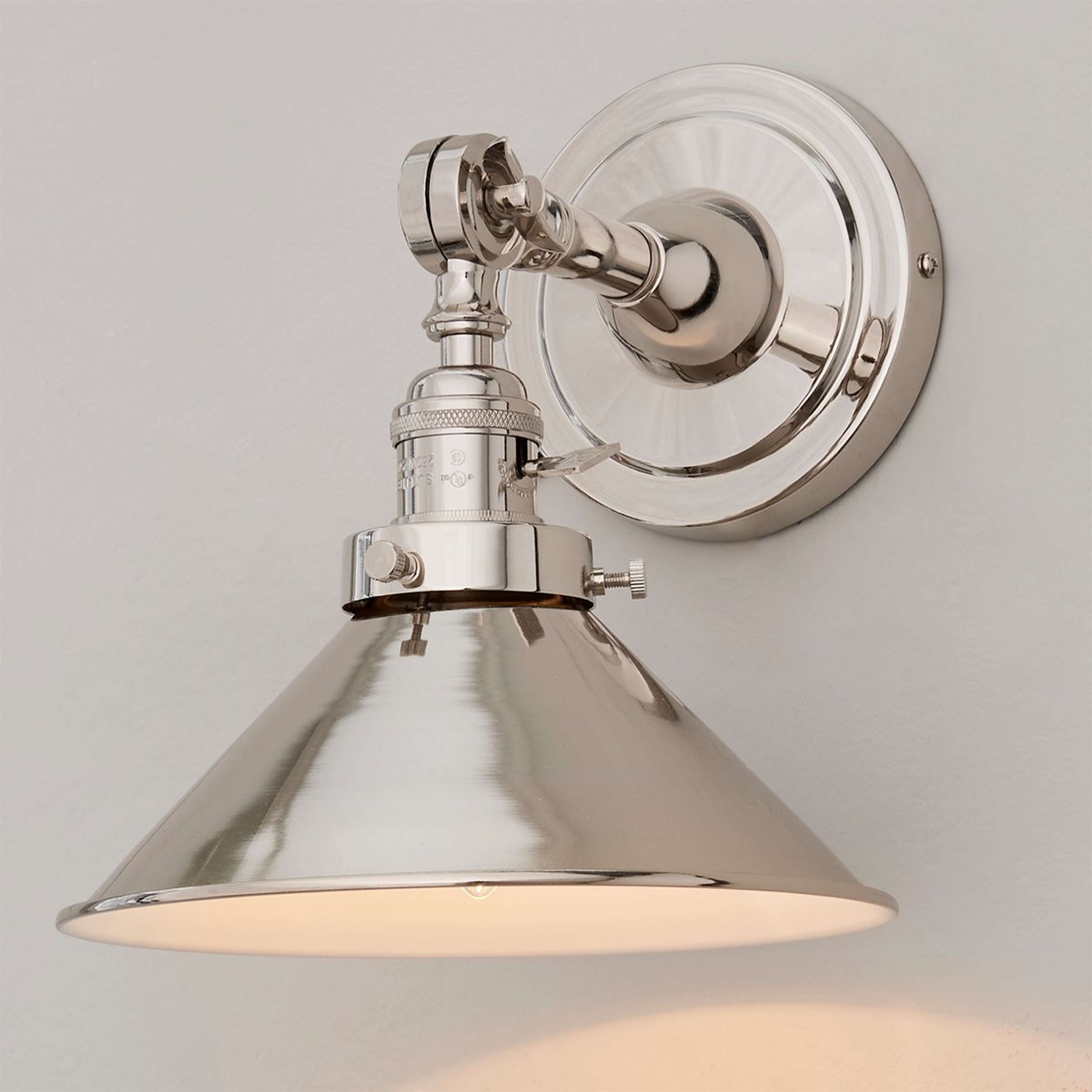 A Banner Swing Arm Bath Sconce - Metal Triangular with Polished Nickel color