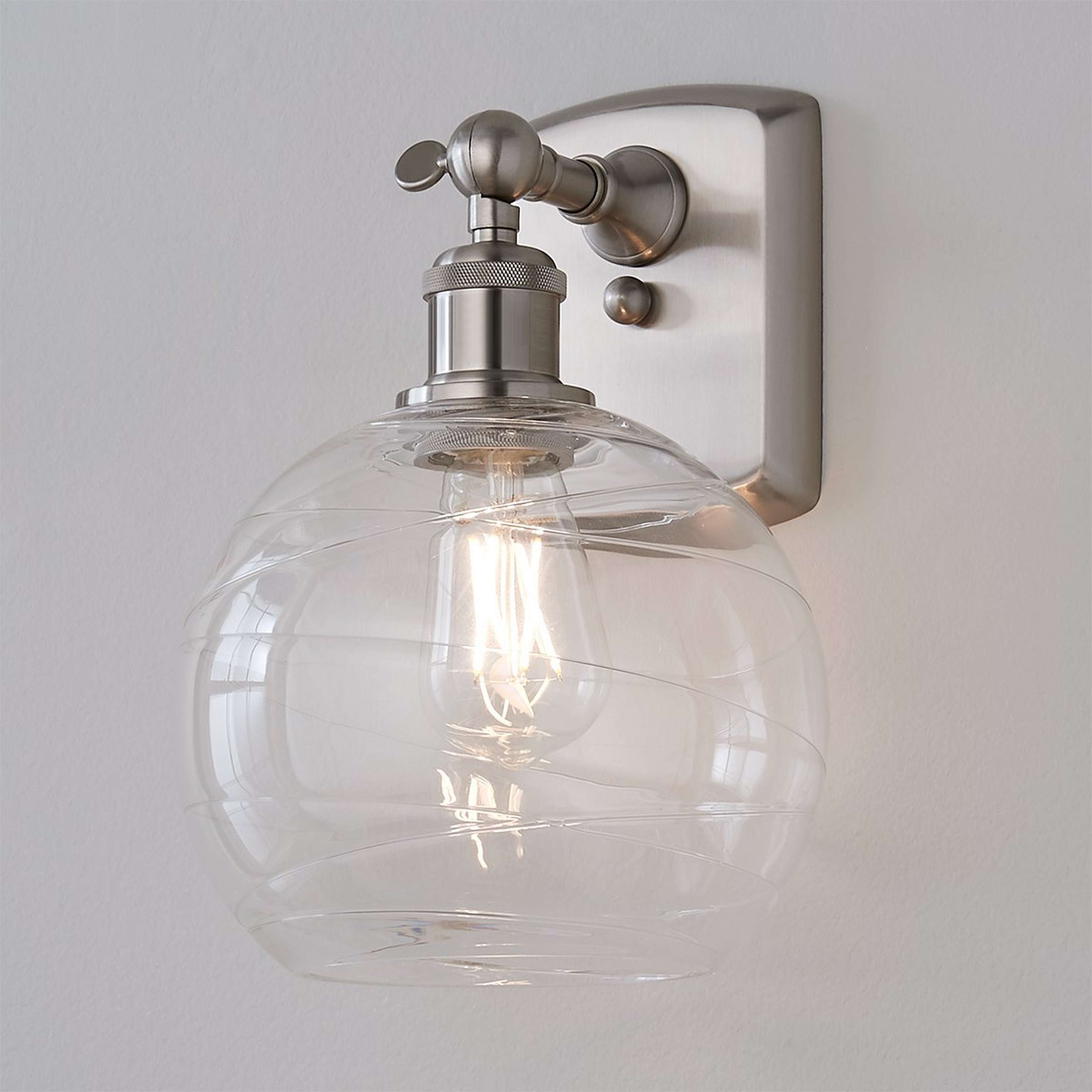 A Sea Swell Swing Arm Sconce with Brushed Nickel / Clear color
