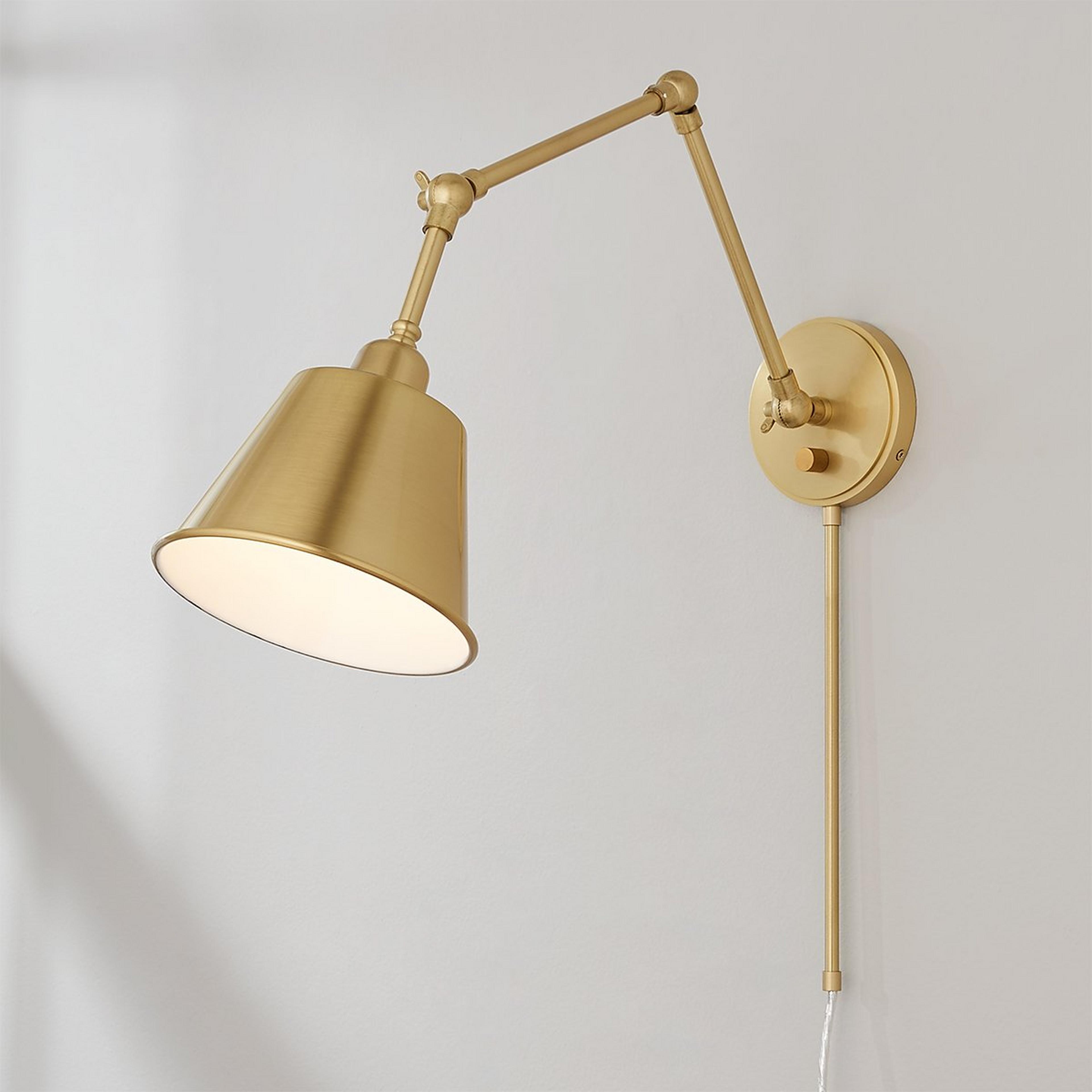 A Rizzio Arched Adjustable Swing Arm with Aged Brass color