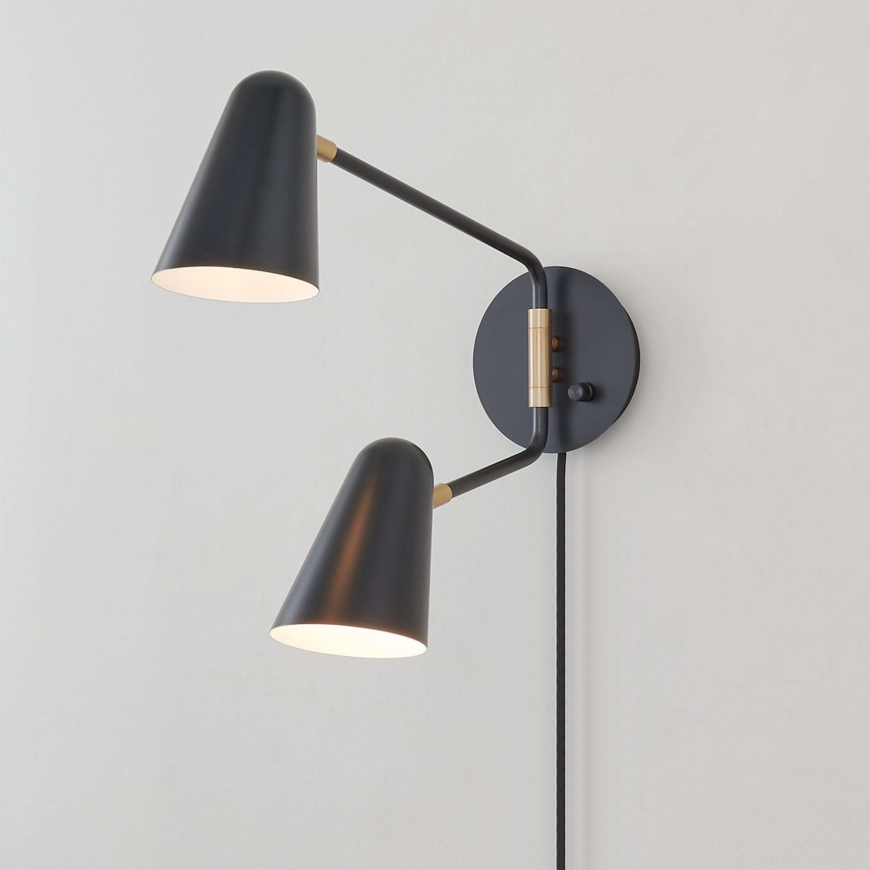 A Jamira Swing Arm Sconce with Black / Brass color